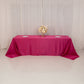 Fuchsia satin tablecloth for 8-foot table with floor-length drop.