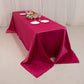 Fuchsia satin tablecloth for 8-foot table with floor-length drop.