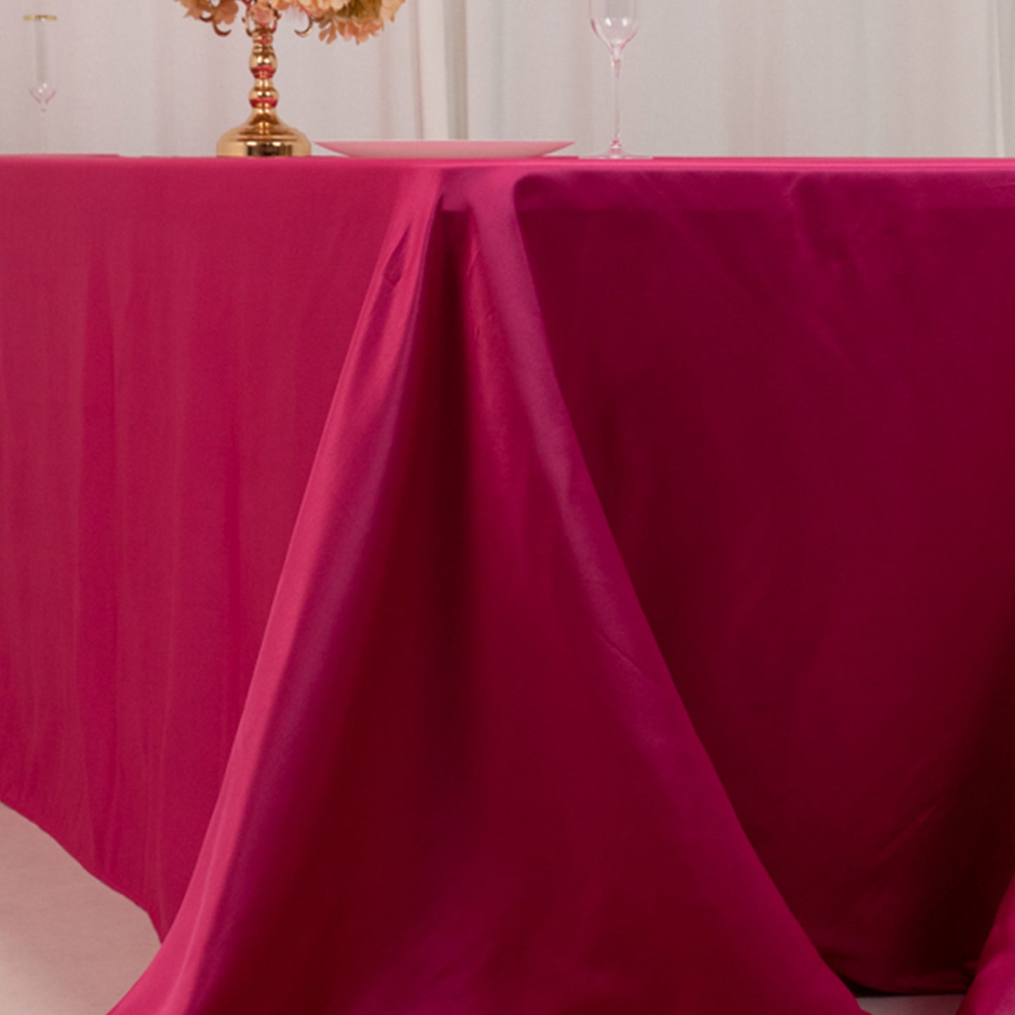 Fuchsia satin tablecloth for 8-foot table with floor-length drop.