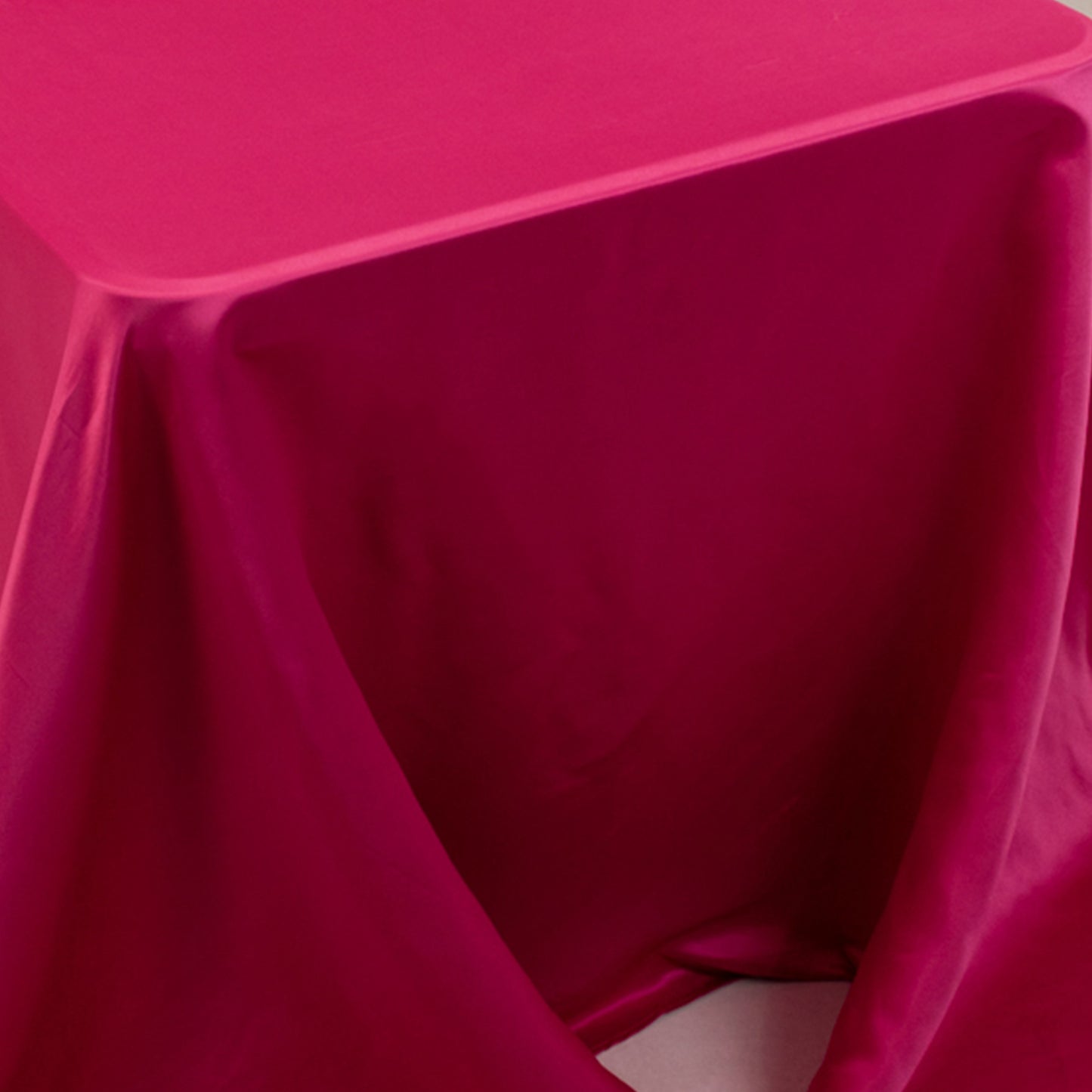 Fuchsia satin tablecloth draped over an 8-foot table.