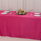 Fuchsia satin tablecloth draped over an 8-foot table with floral centerpiece.