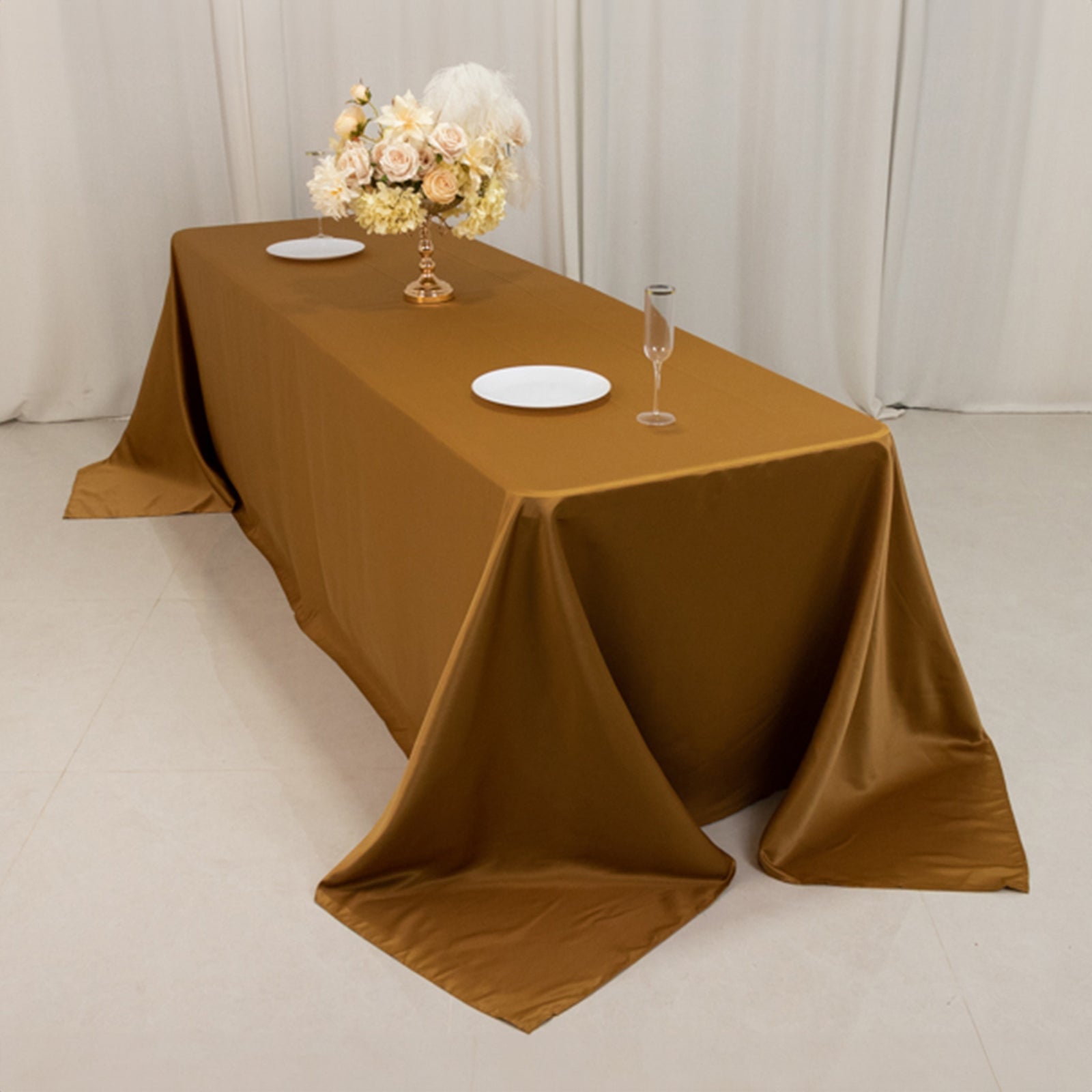 Gold satin tablecloth for 8-foot table with floor-length drop.