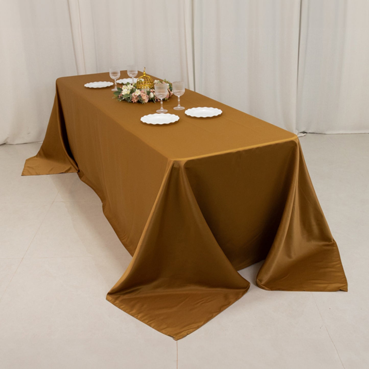 Gold satin tablecloth for 8-foot table with floor-length drop.