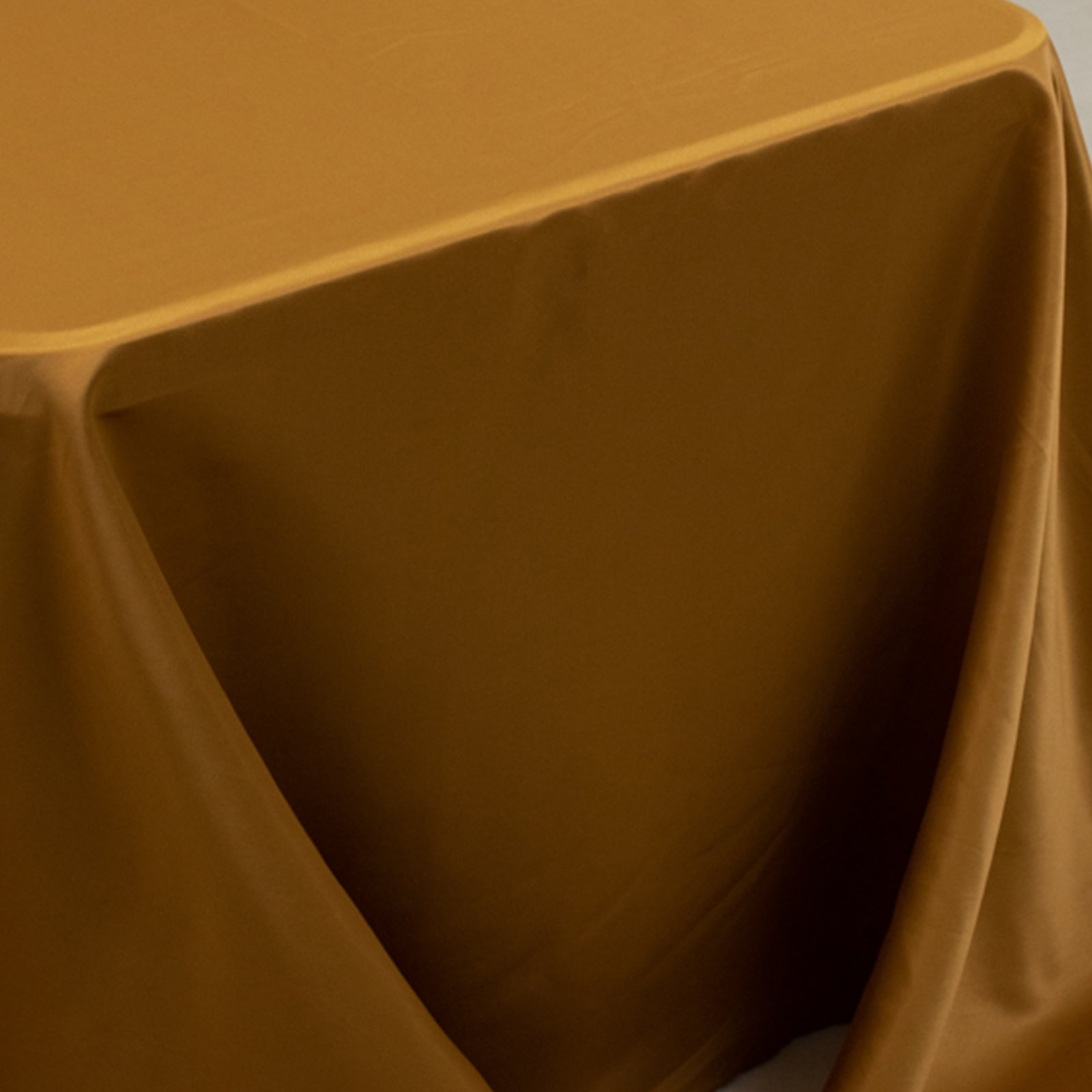 Gold satin tablecloth for 8-foot table with floor-length drop.