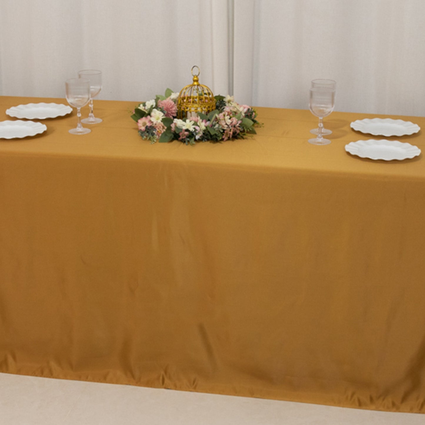 Gold rectangular tablecloth for 8-foot table with floor-length drop.