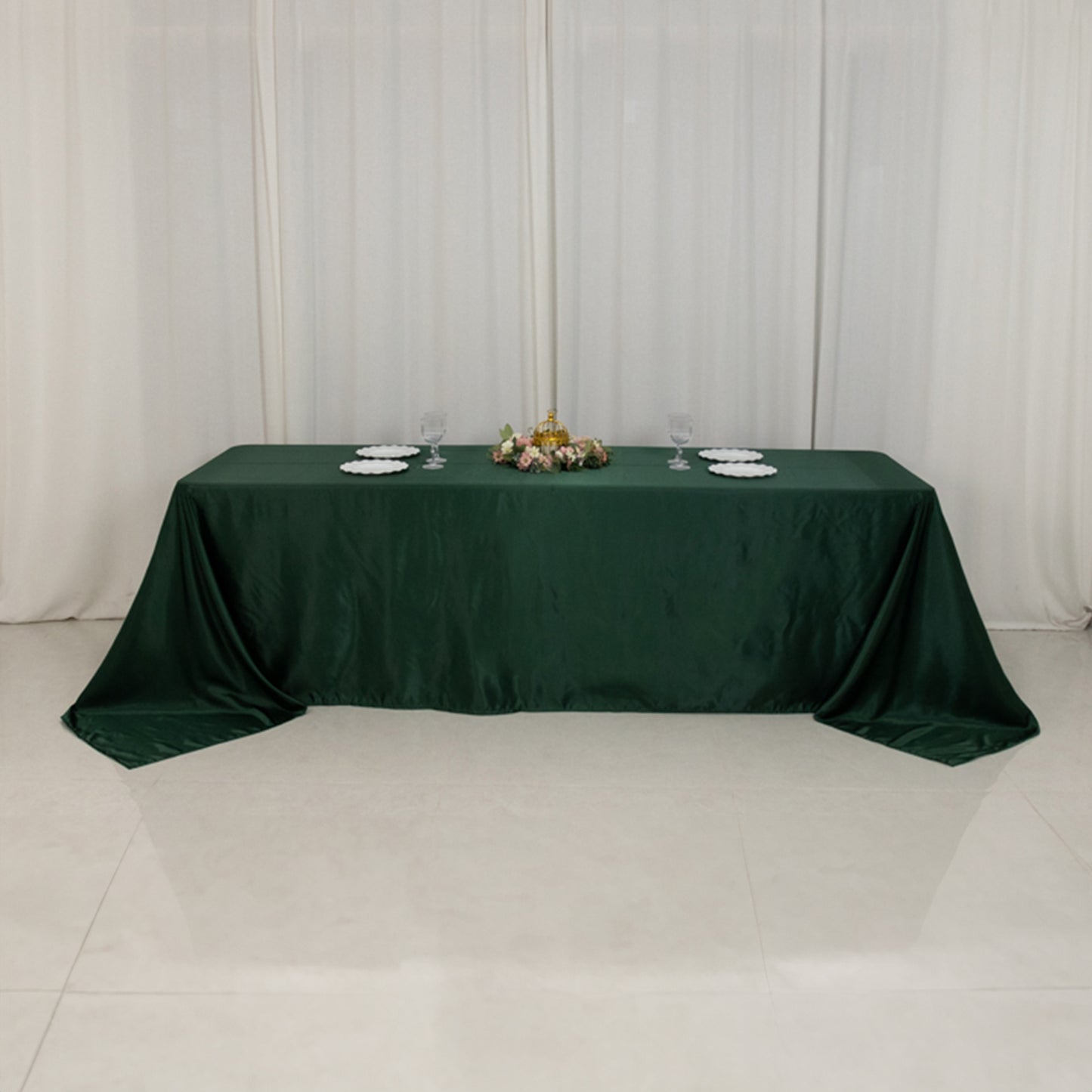 Hunter Emerald Green tablecloth on an 8-foot table with a floor-length drop.