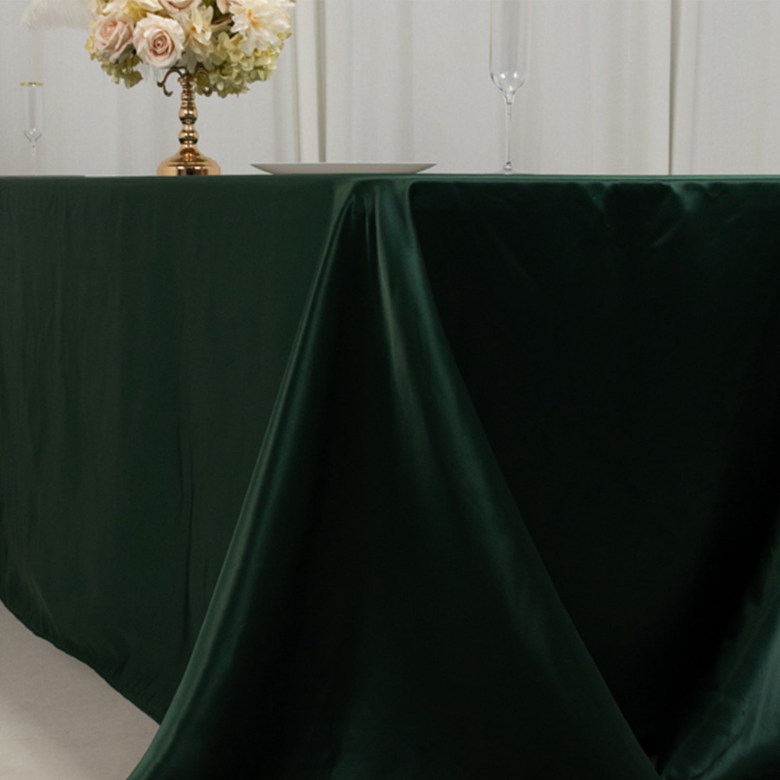 Hunter emerald green satin tablecloth for 8-foot table with floor-length drop.