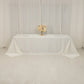 Ivory seamless satin tablecloth for 8-foot table with floor-length drop.