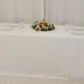 Ivory satin tablecloth for 8-foot table with floral centerpiece.