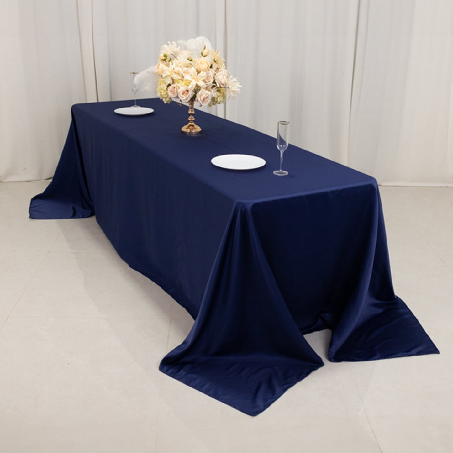 Navy blue seamless satin tablecloth for an 8-foot table with floor-length drop.