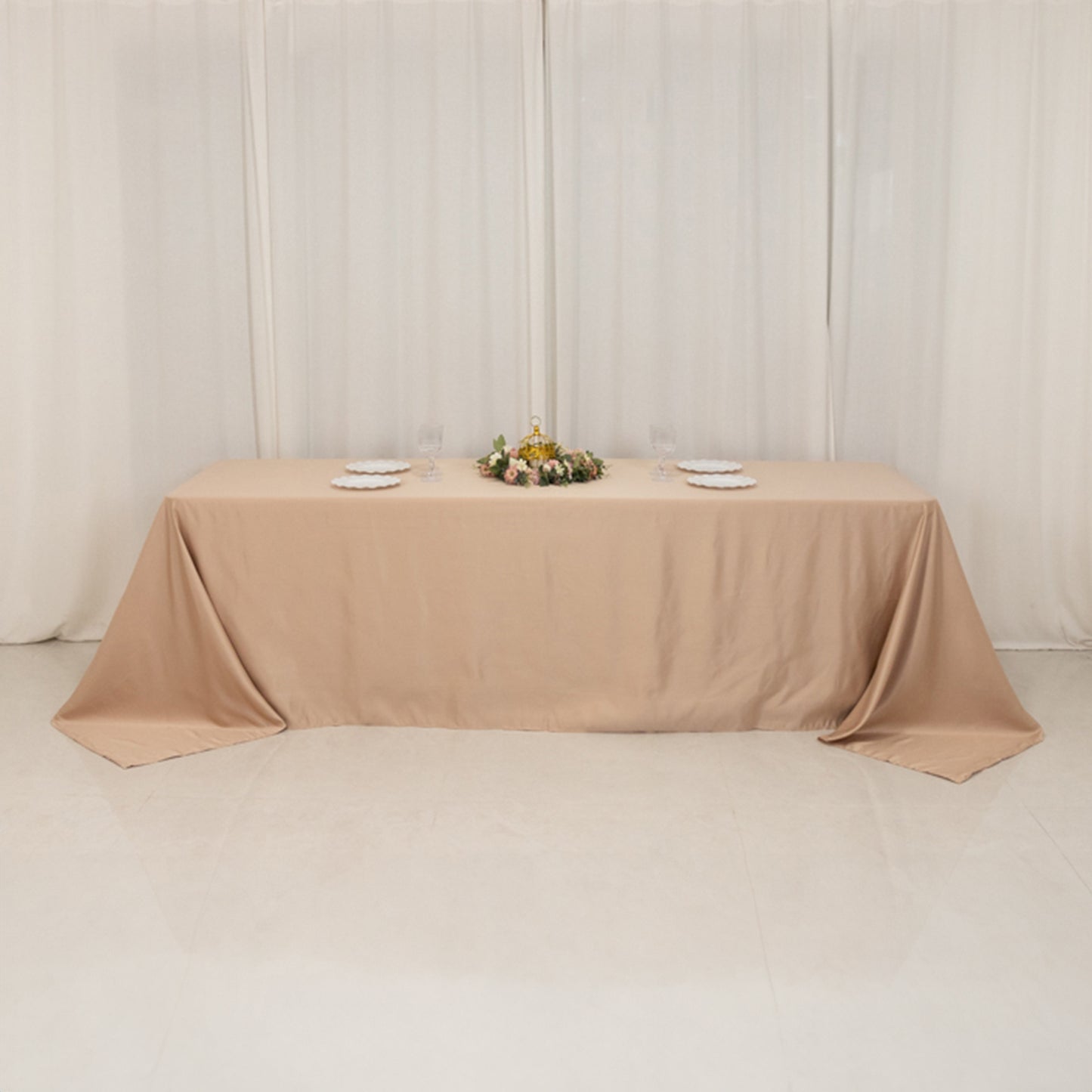 Nude seamless satin tablecloth for 8-foot table with floor-length drop.