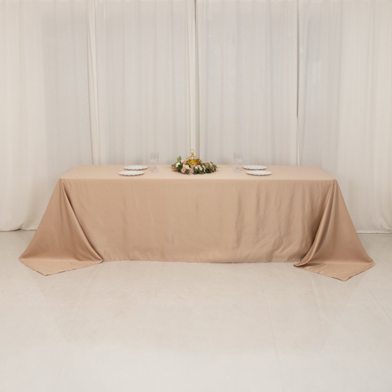 Nude seamless satin tablecloth for 8-foot table with floor-length drop.