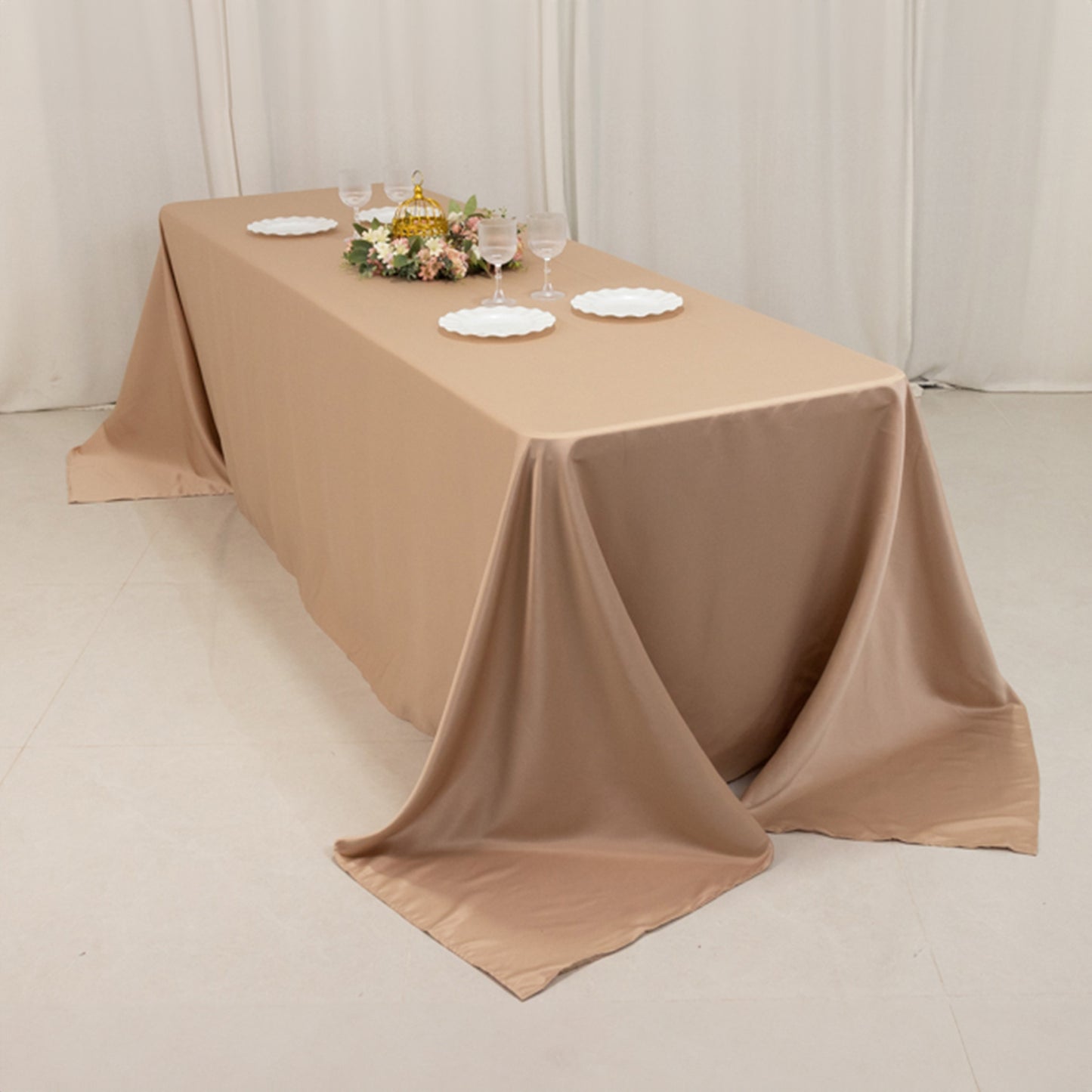 Nude seamless satin tablecloth for 8-foot table with floor-length drop.