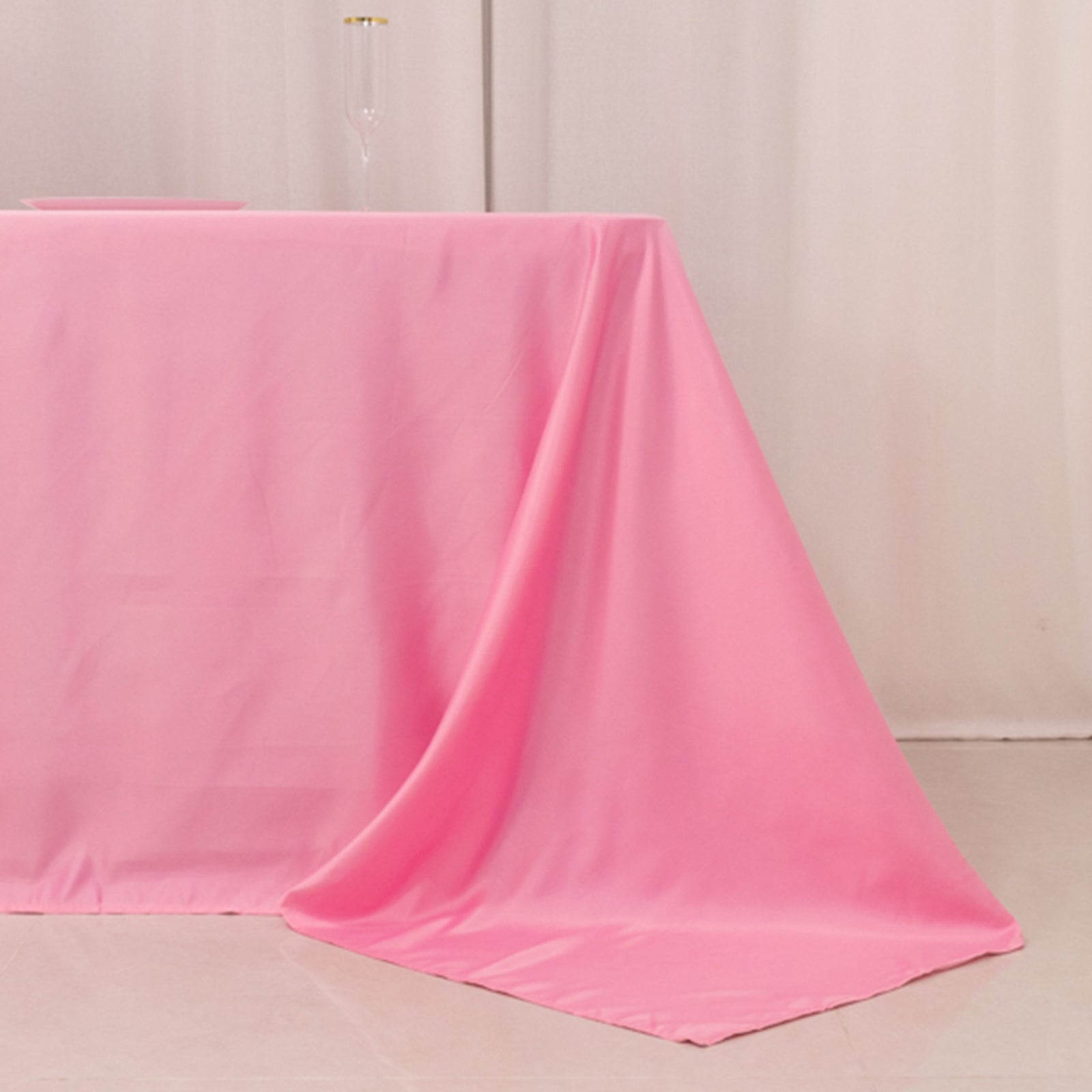 Pink satin tablecloth for an 8-foot table with floor-length drop.