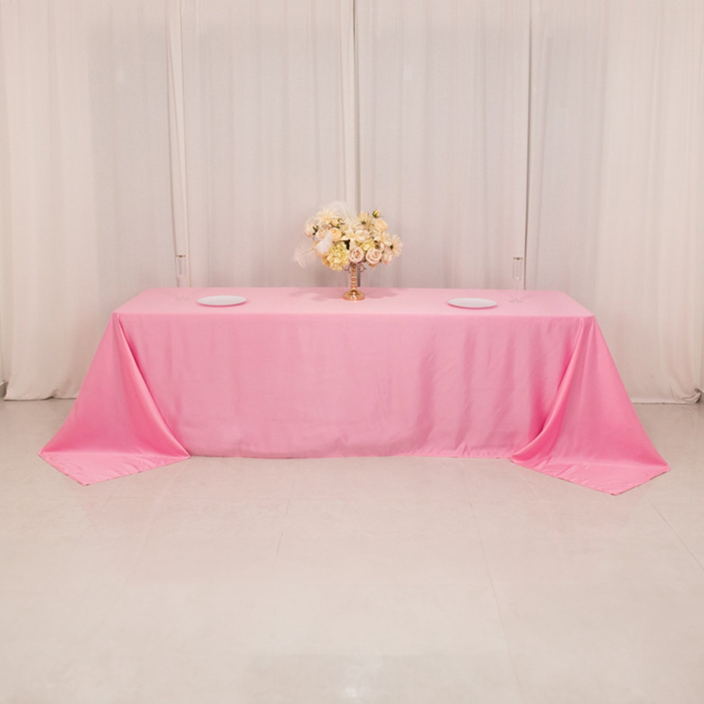 Pink satin tablecloth for 8-foot table with floor-length drop.