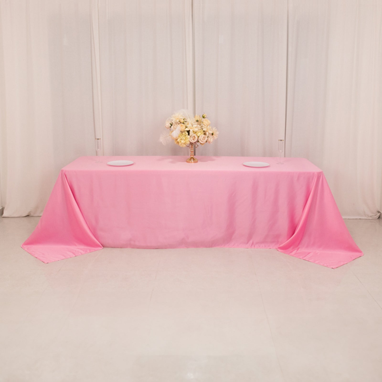 Pink satin tablecloth for 8-foot table with floor-length drop.