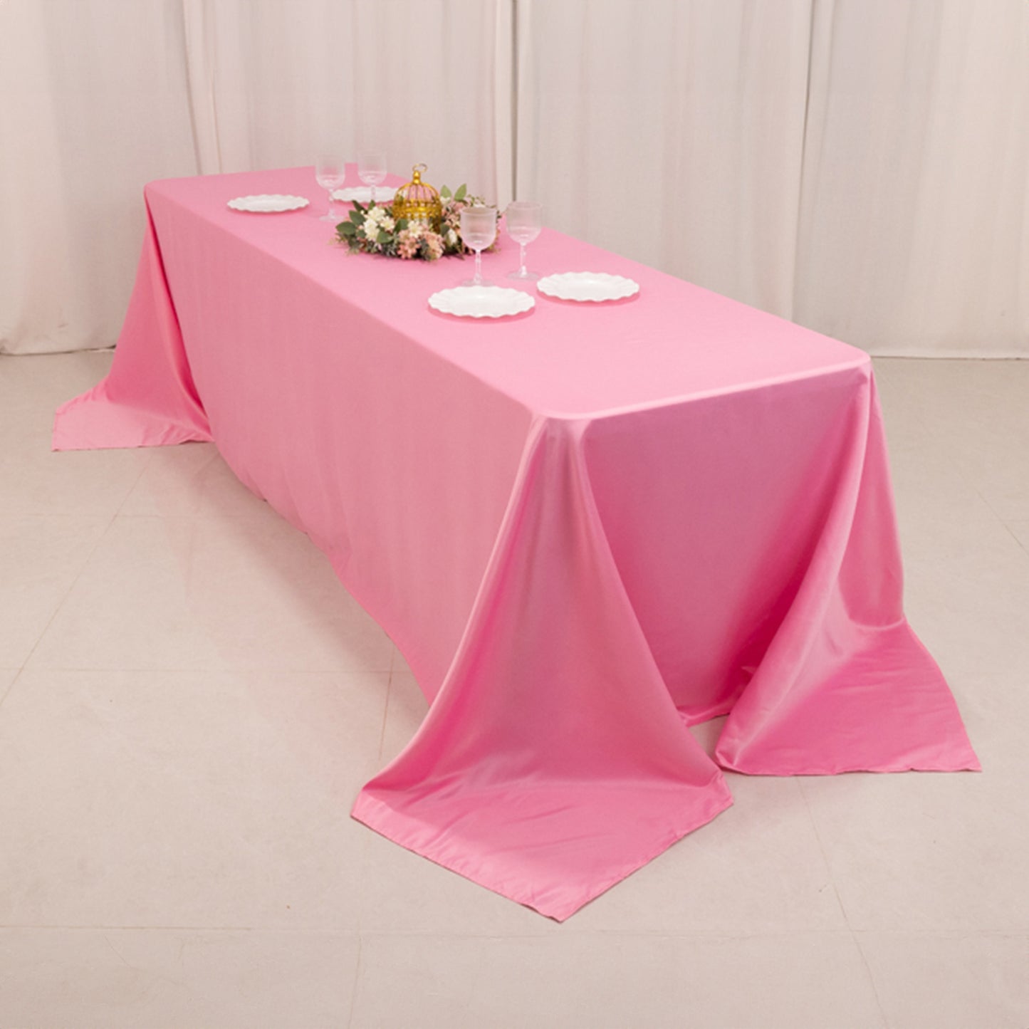 Pink satin tablecloth for 8-foot table with floor-length drop.