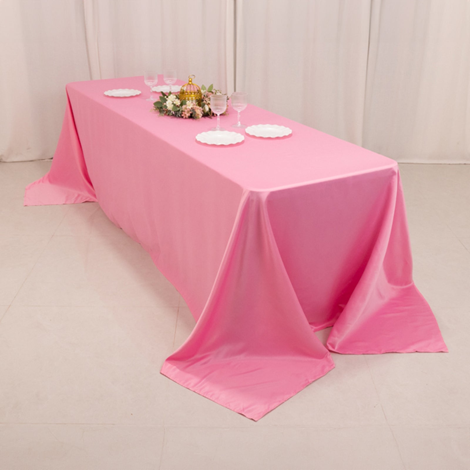 Pink satin tablecloth for 8-foot table with floor-length drop.