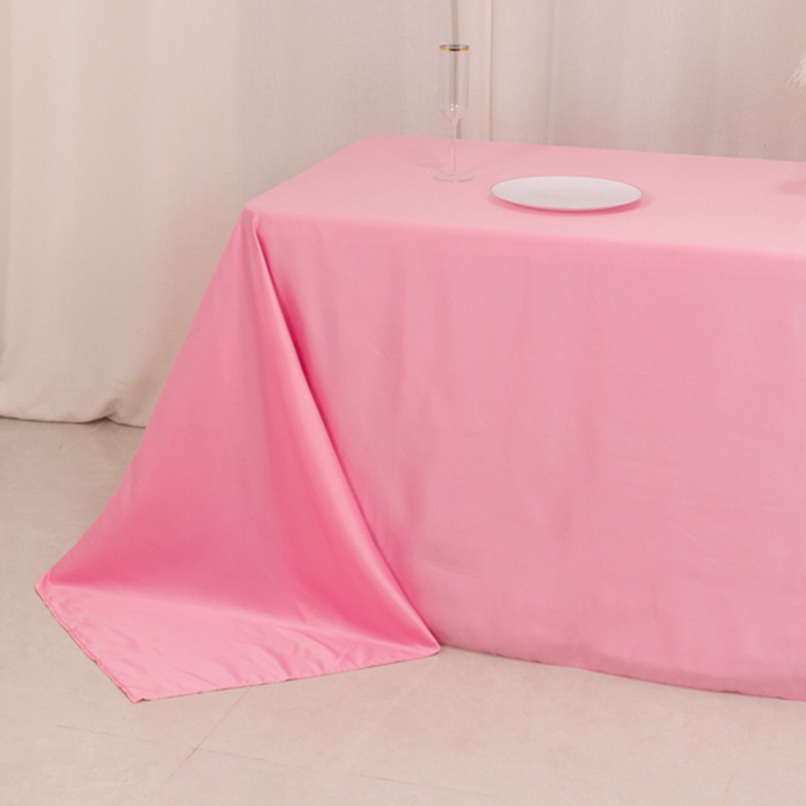 Pink satin tablecloth for an 8-foot table with a floor-length drop.