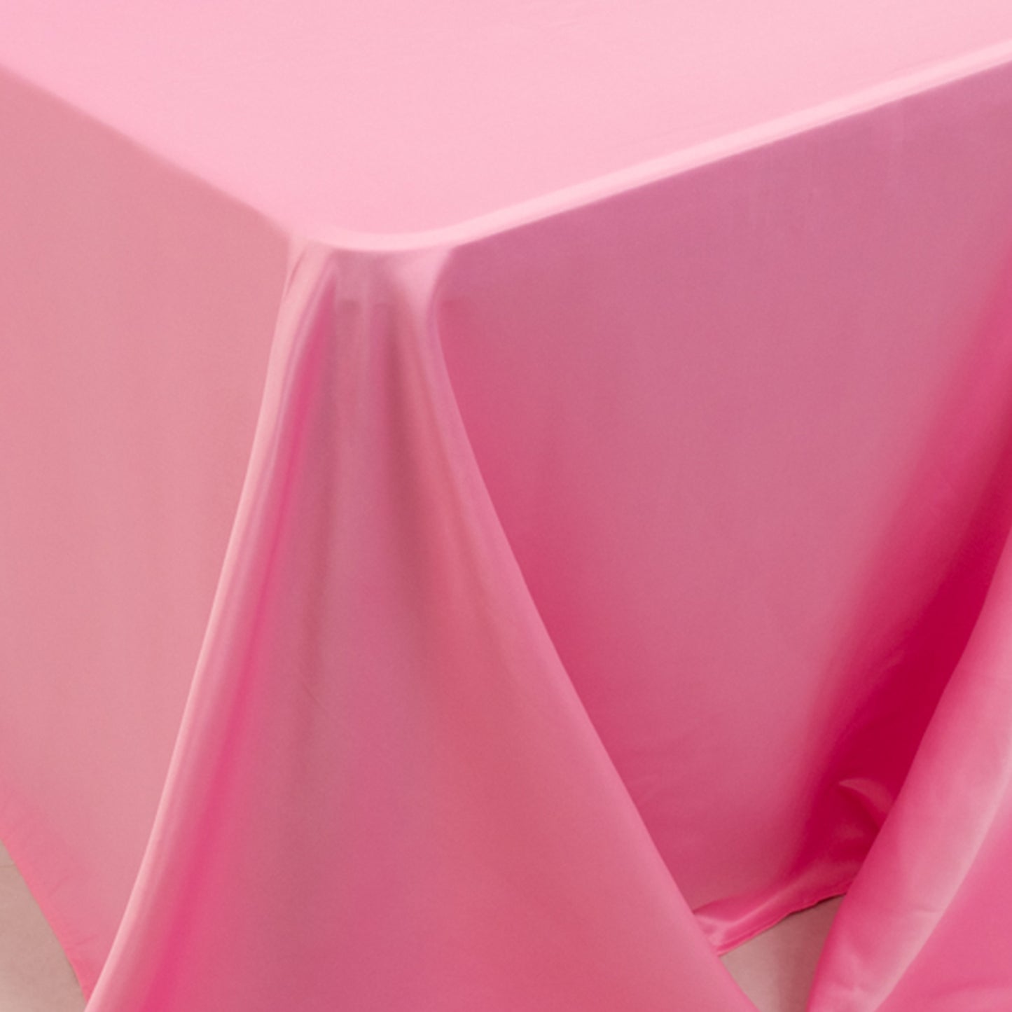 Pink satin tablecloth for 8-foot table with floor-length drop.