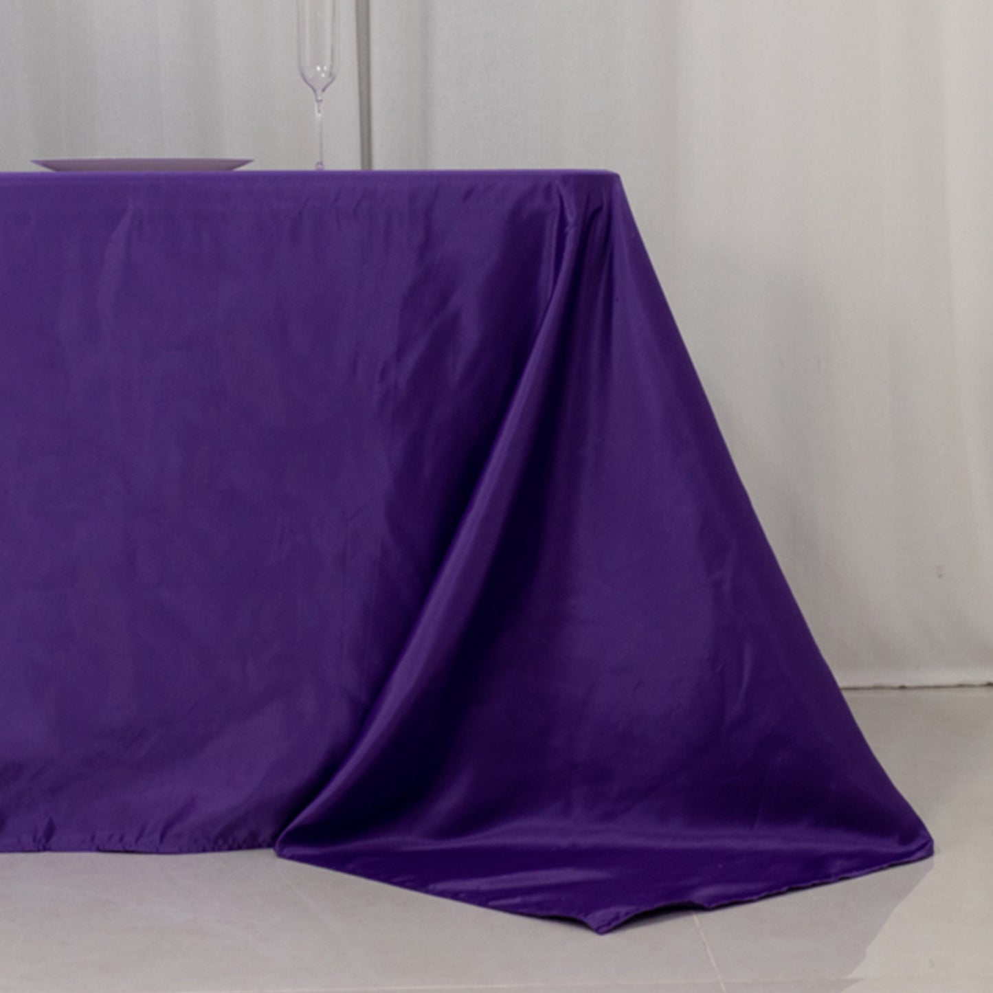 Purple satin tablecloth for 8-foot table with floor-length drop.