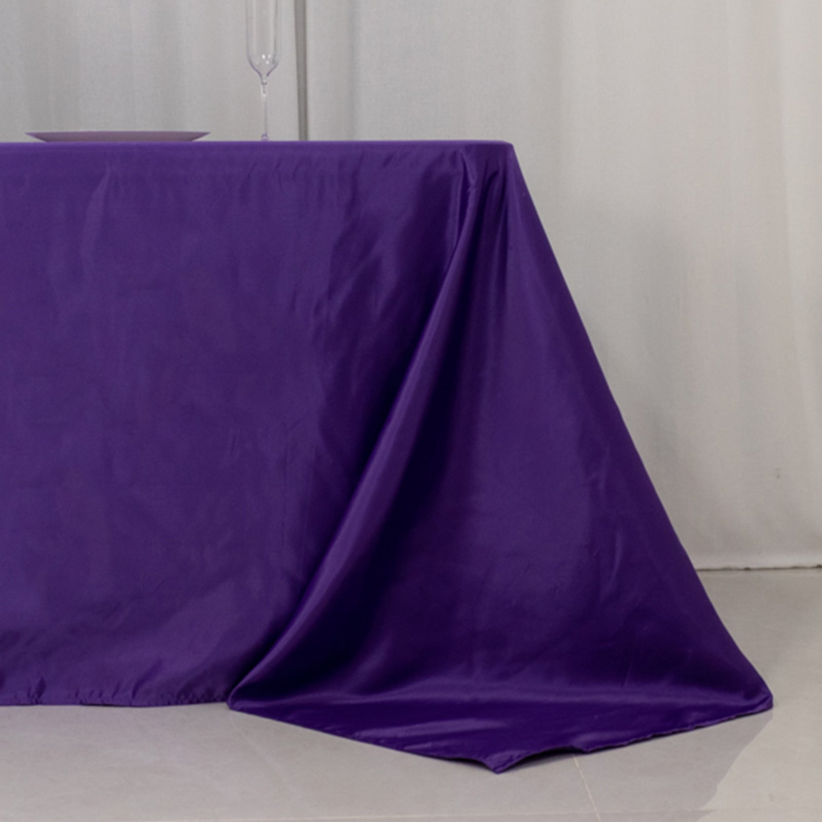 Purple satin tablecloth for 8-foot table with floor-length drop.