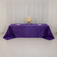 Purple seamless satin tablecloth for 8-foot table with floor-length drop.