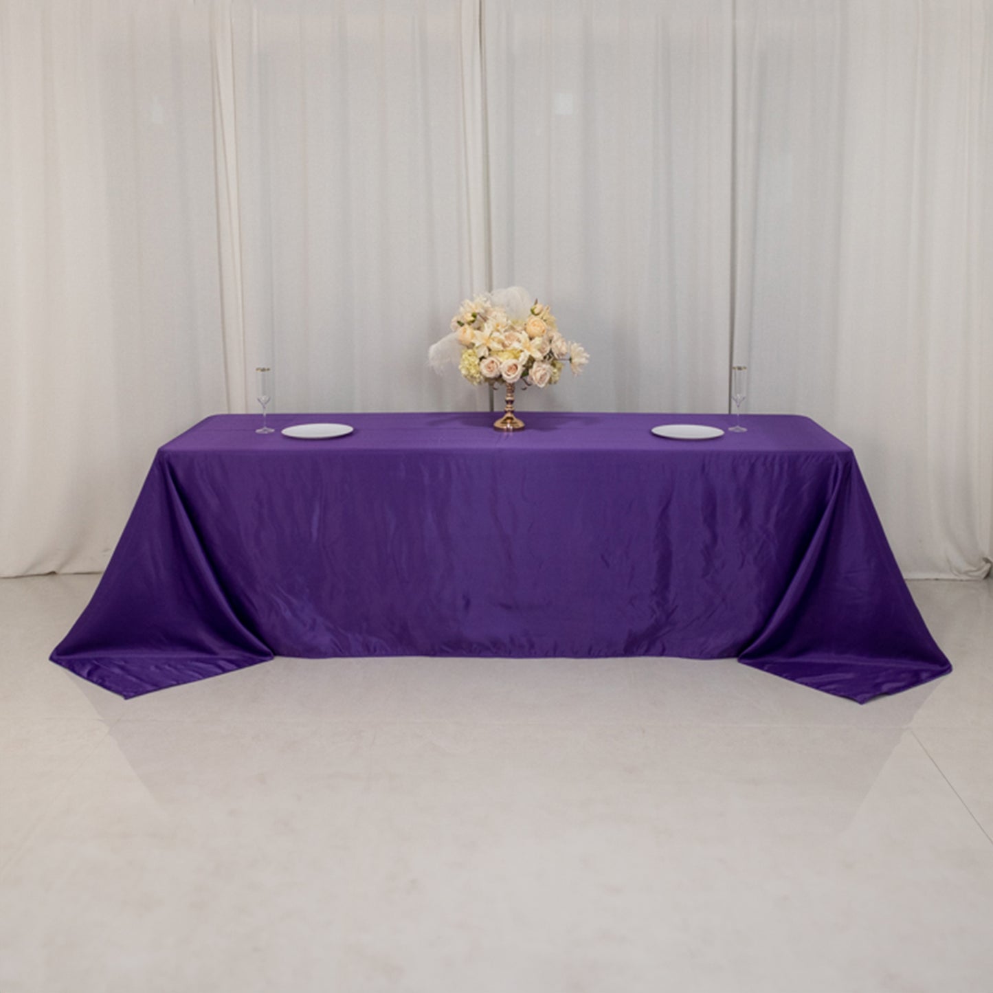 Purple seamless satin tablecloth for 8-foot table with floor-length drop.