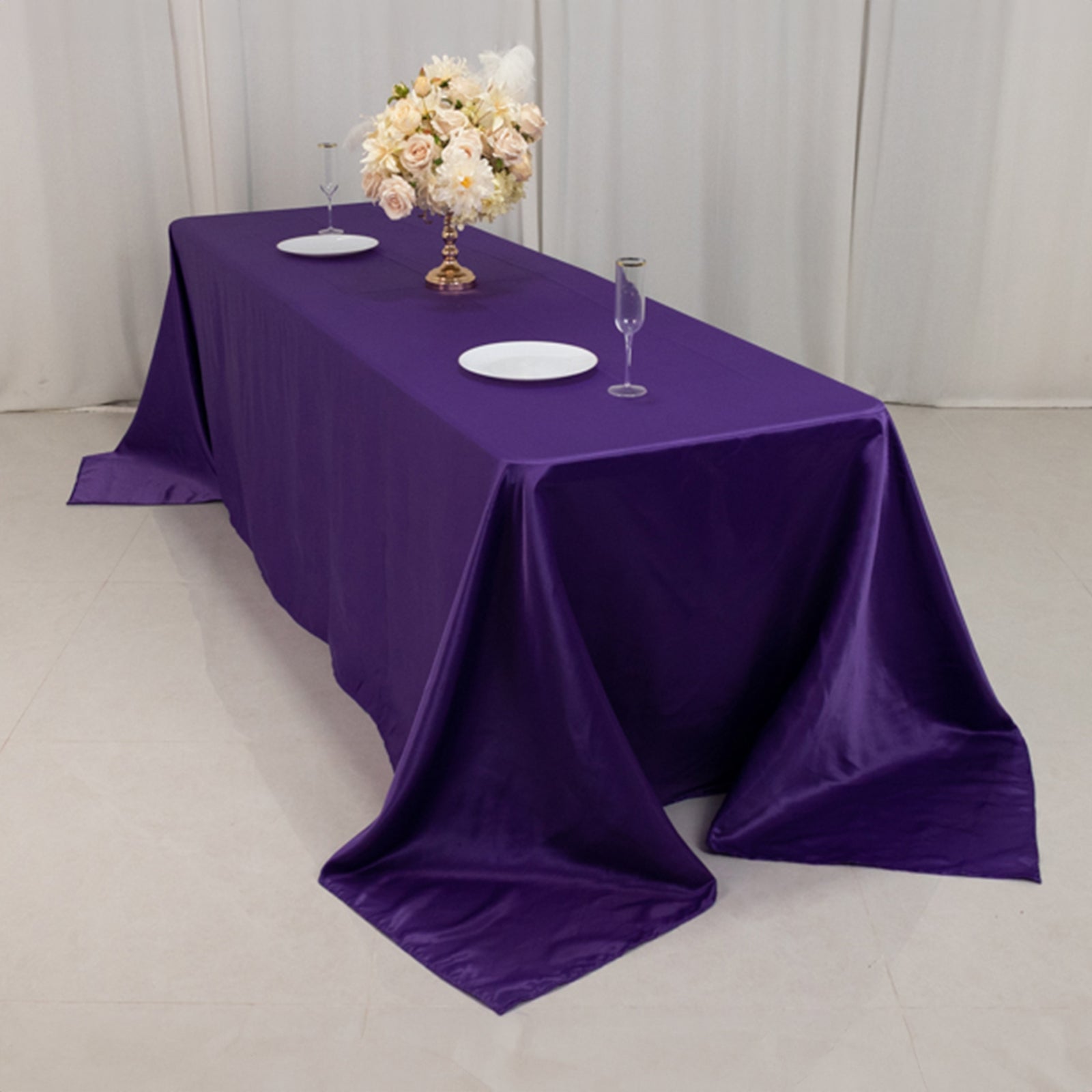Purple satin tablecloth for 8-foot table with floor-length drop.