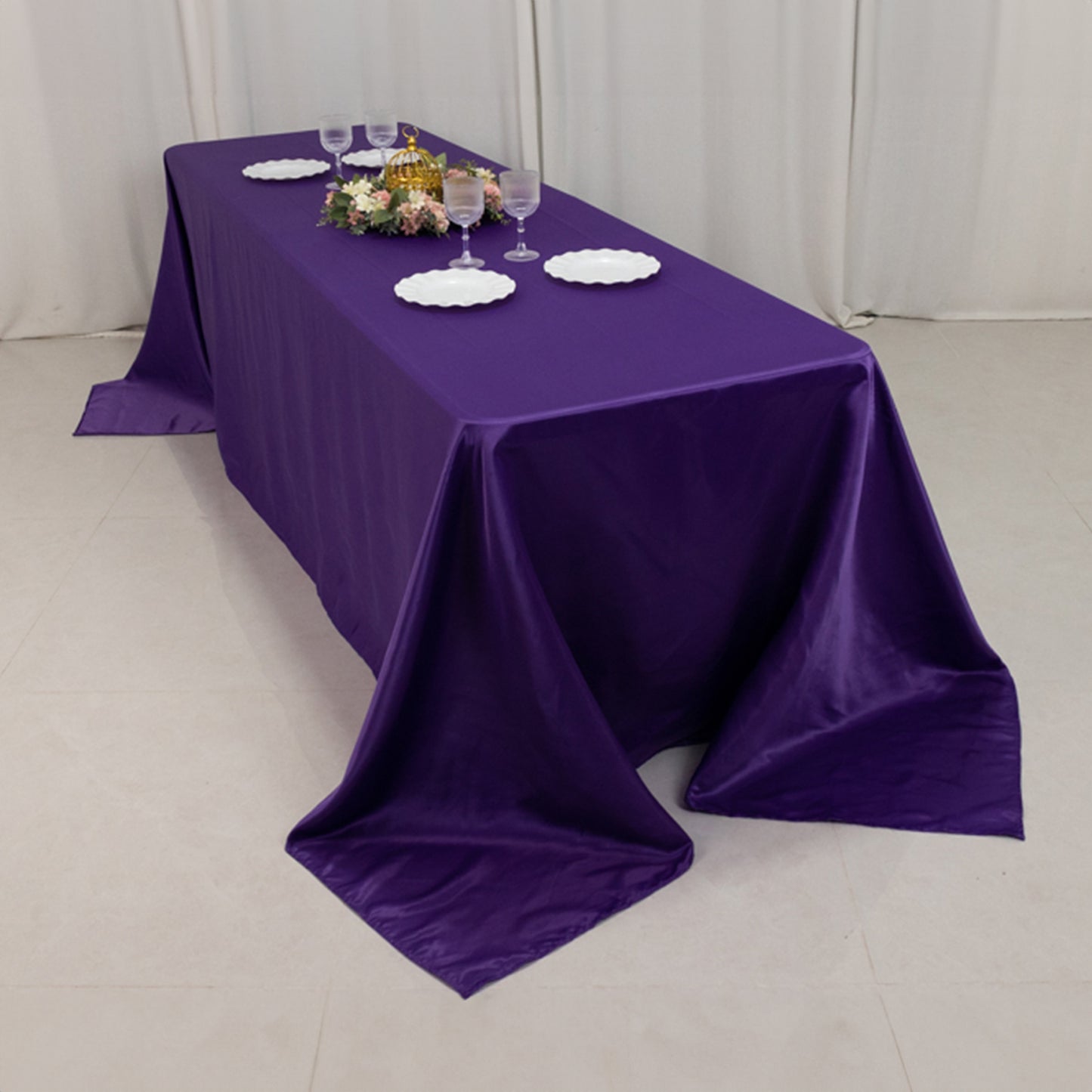 Purple satin tablecloth for 8-foot table with floor-length drop.