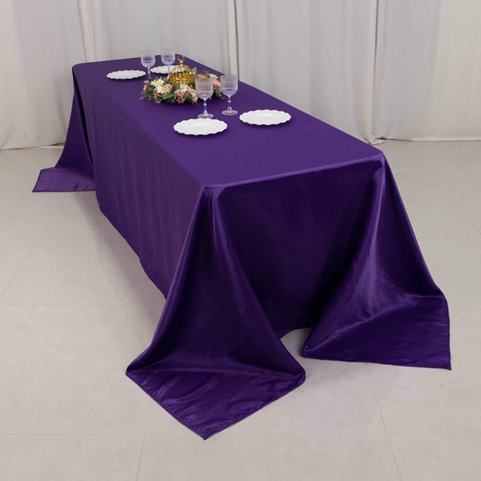 Purple satin tablecloth for 8-foot table with floor-length drop.