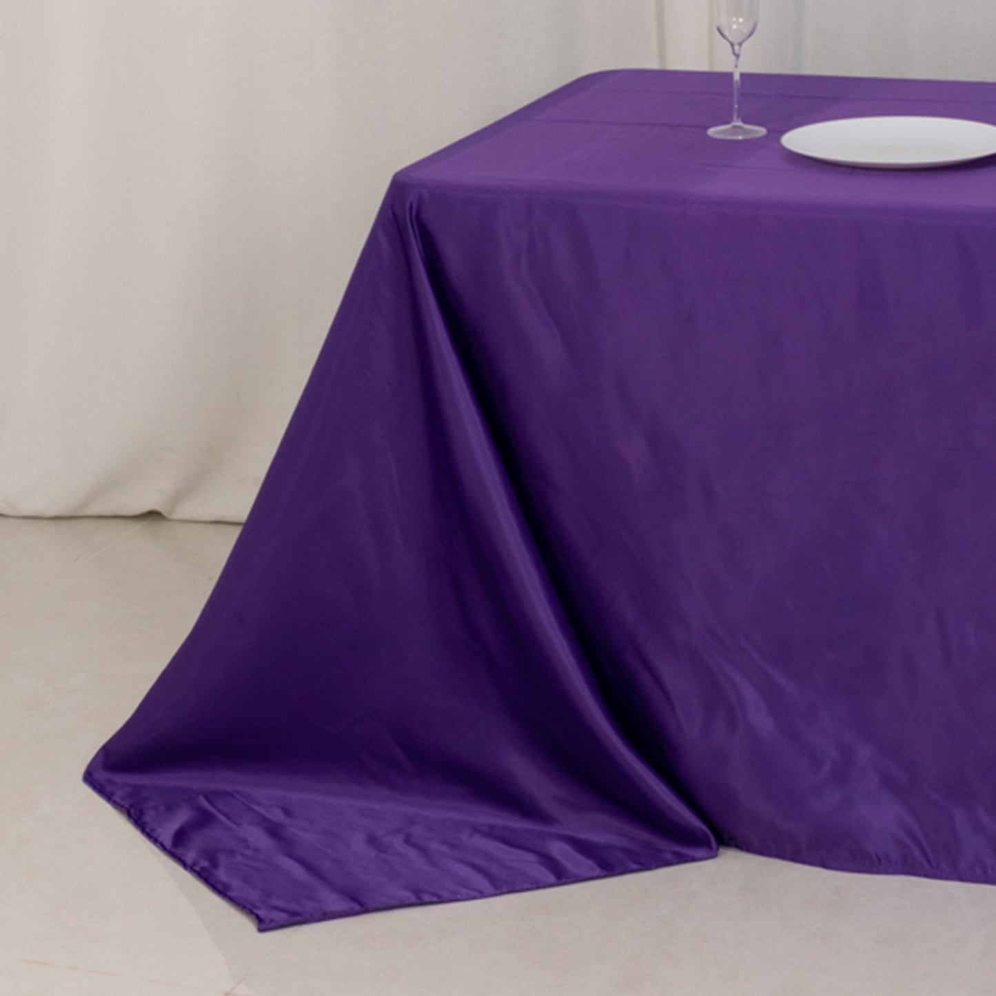 Purple satin tablecloth for an 8-foot table with floor-length drop.