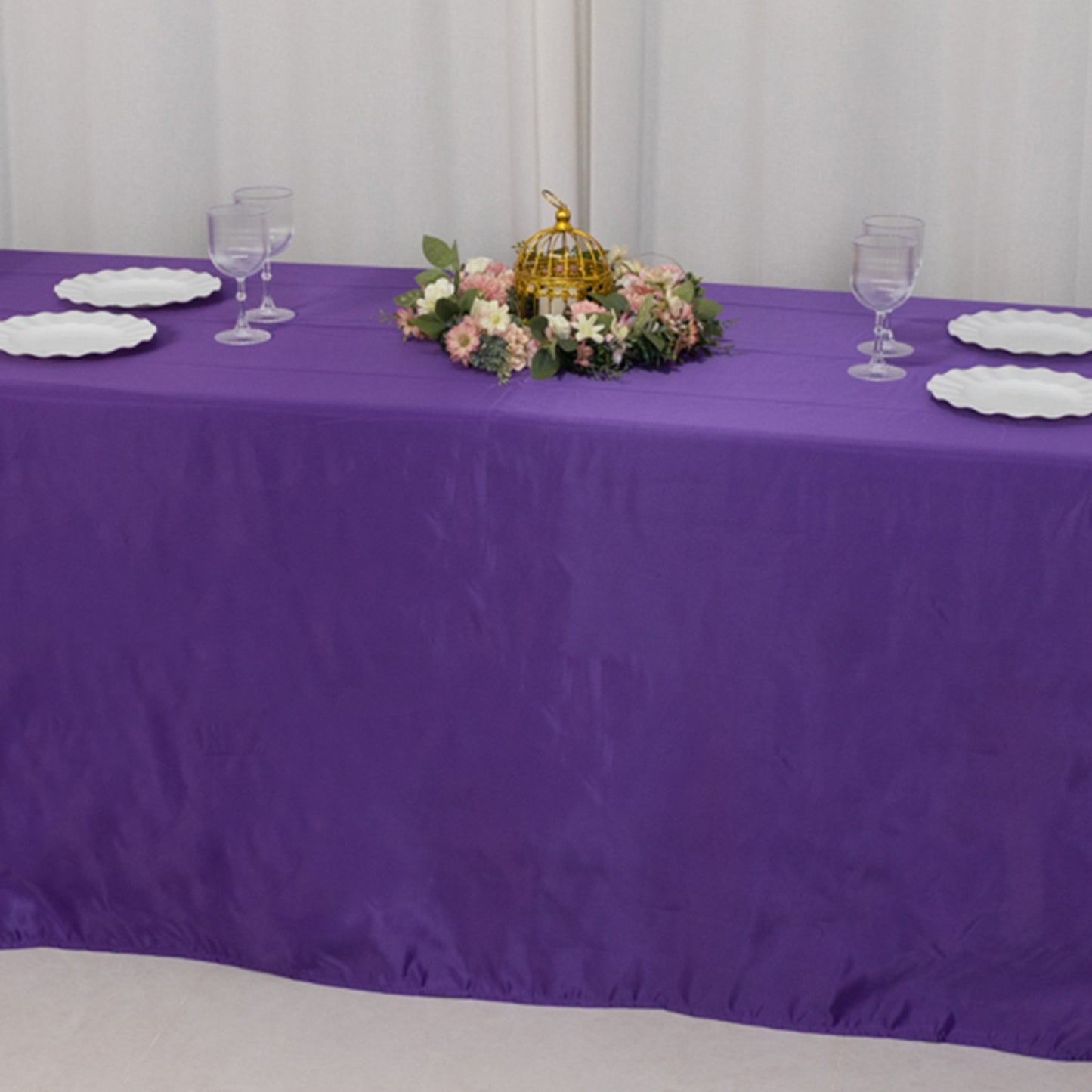 Purple satin tablecloth for 8-foot table with floor-length drop.