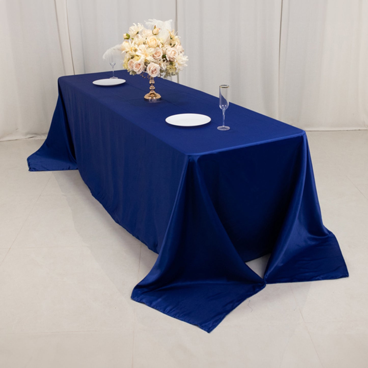 Royal blue seamless satin tablecloth for 8-foot table with floor-length drop.