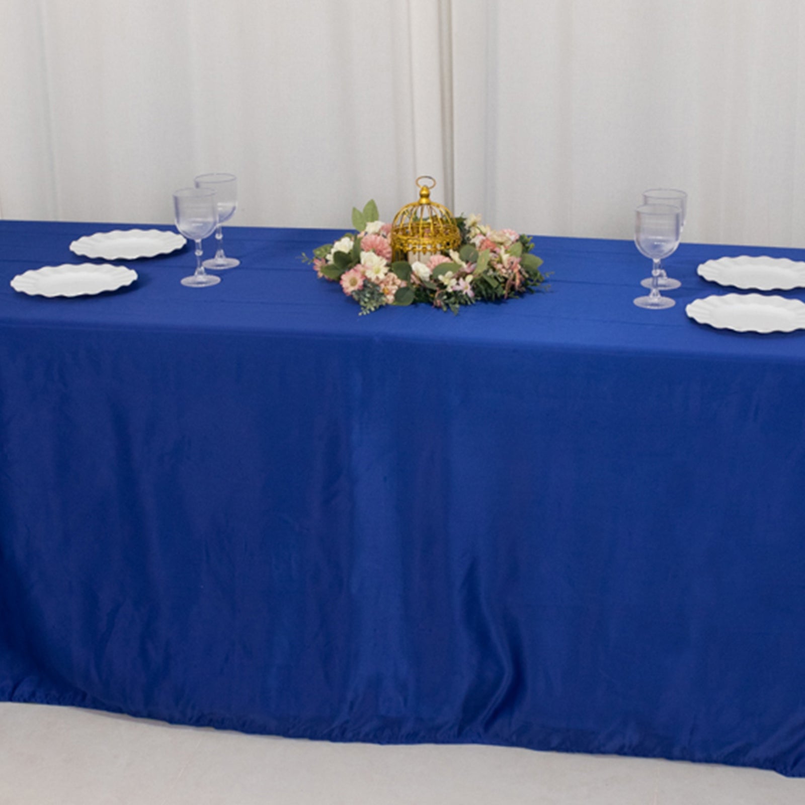 Royal blue seamless satin tablecloth for 8-foot table with floor-length drop.
