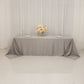 Silver satin tablecloth for 8-foot table with floor-length drop.