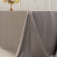 Silver seamless satin tablecloth for 8-foot table with floor-length drop.