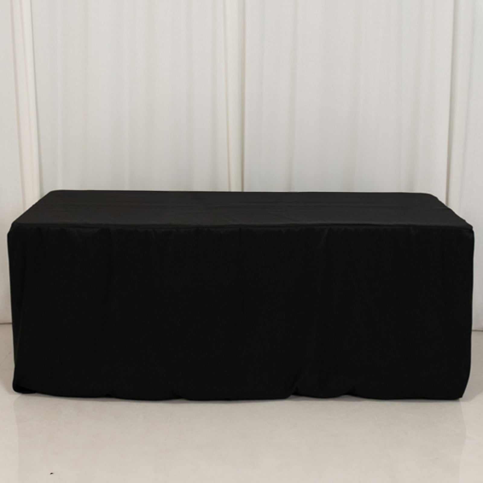 Black fitted premium polyester tablecloth for 6ft tables.