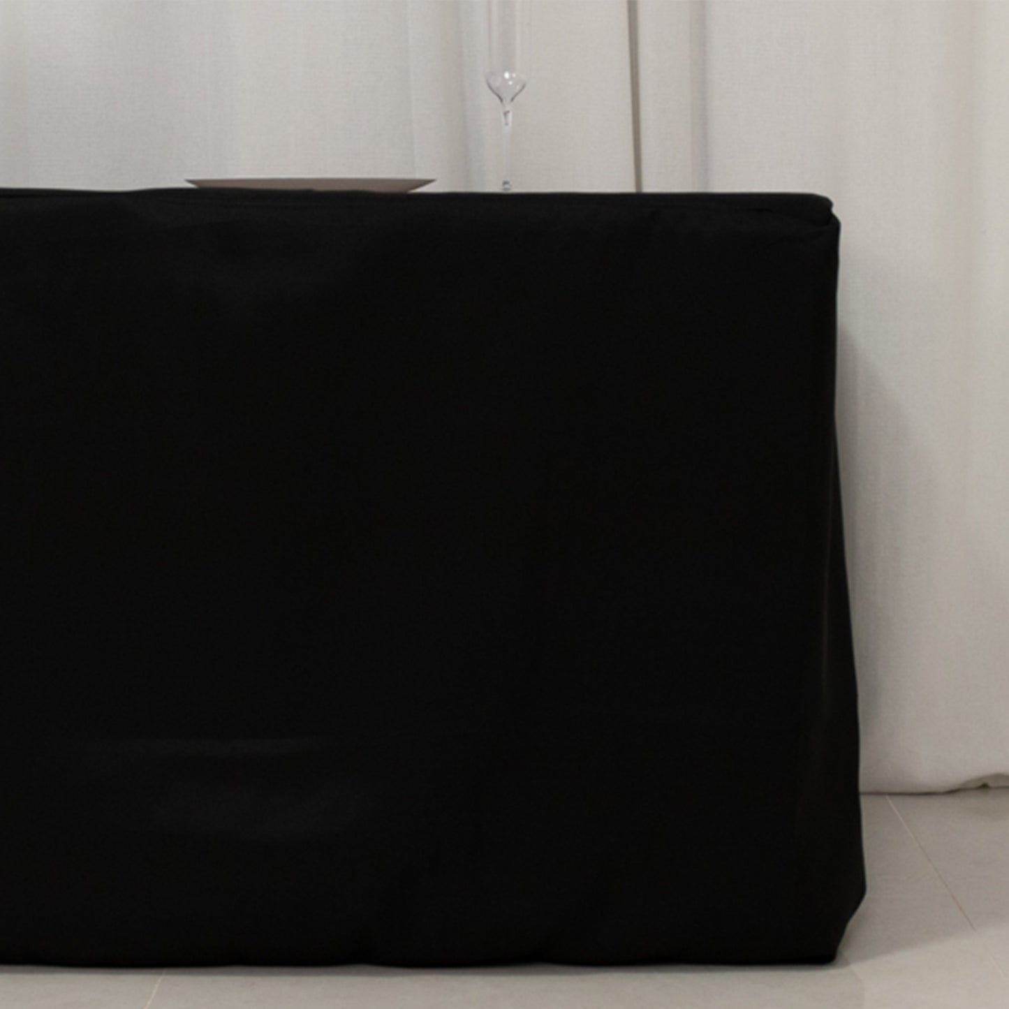 Black fitted premium polyester tablecloth for 8ft tables.