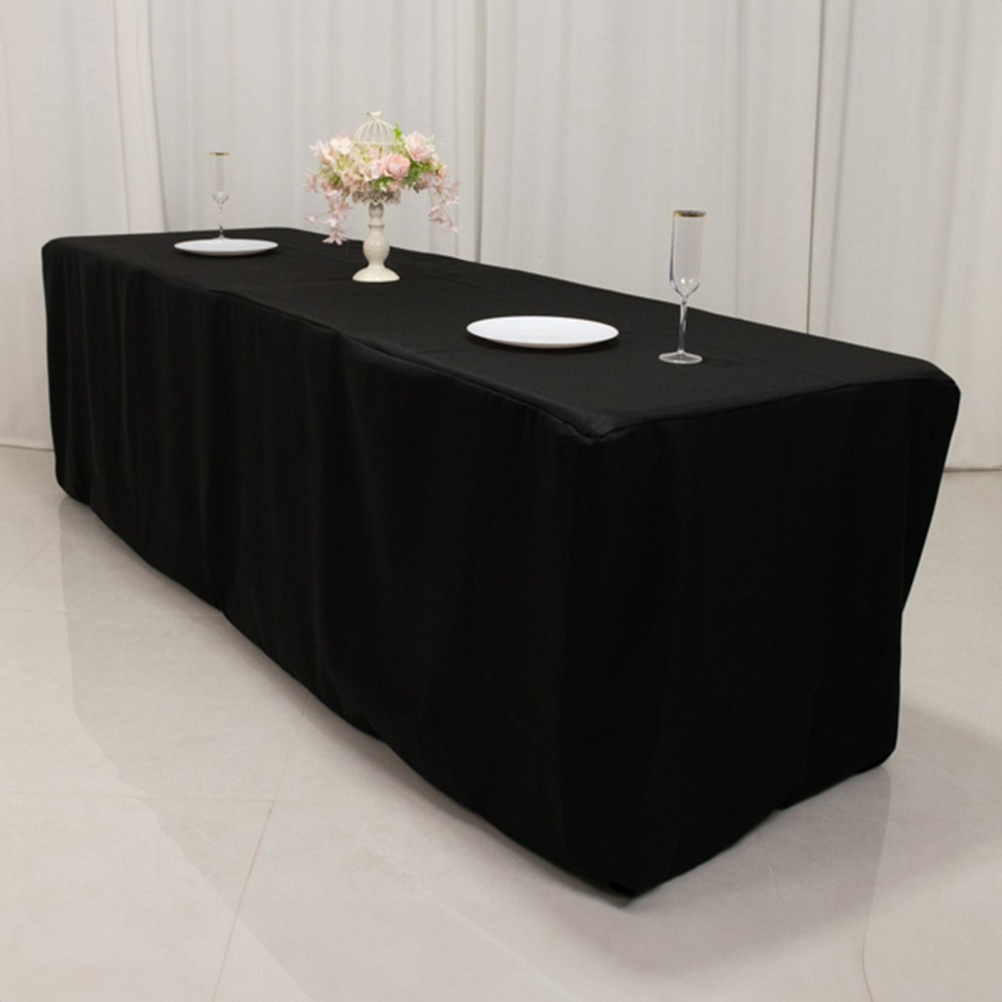 Black fitted premium polyester tablecloth for 8ft tables.