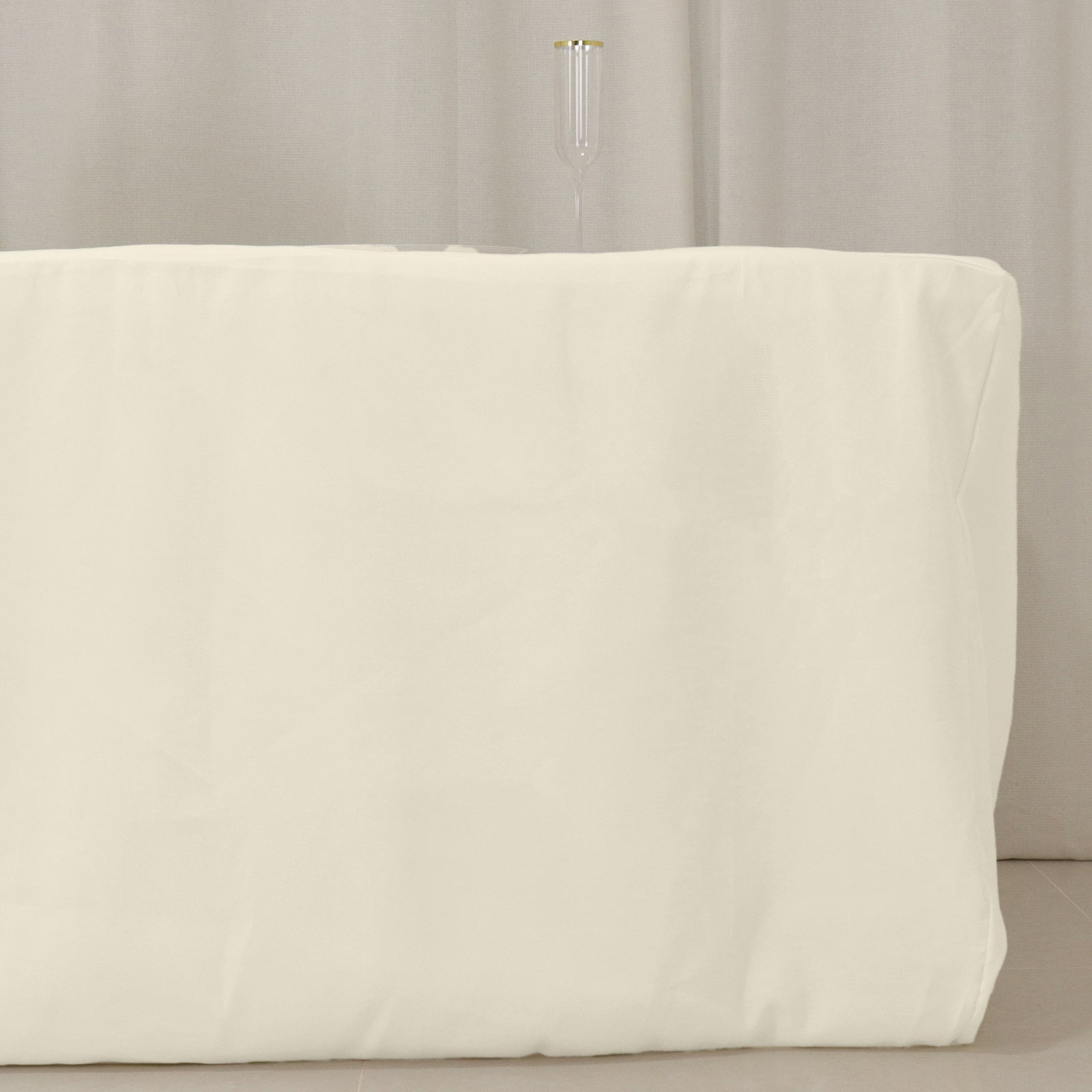 Ivory fitted tablecloth for 8ft tables, perfect for events and gatherings.