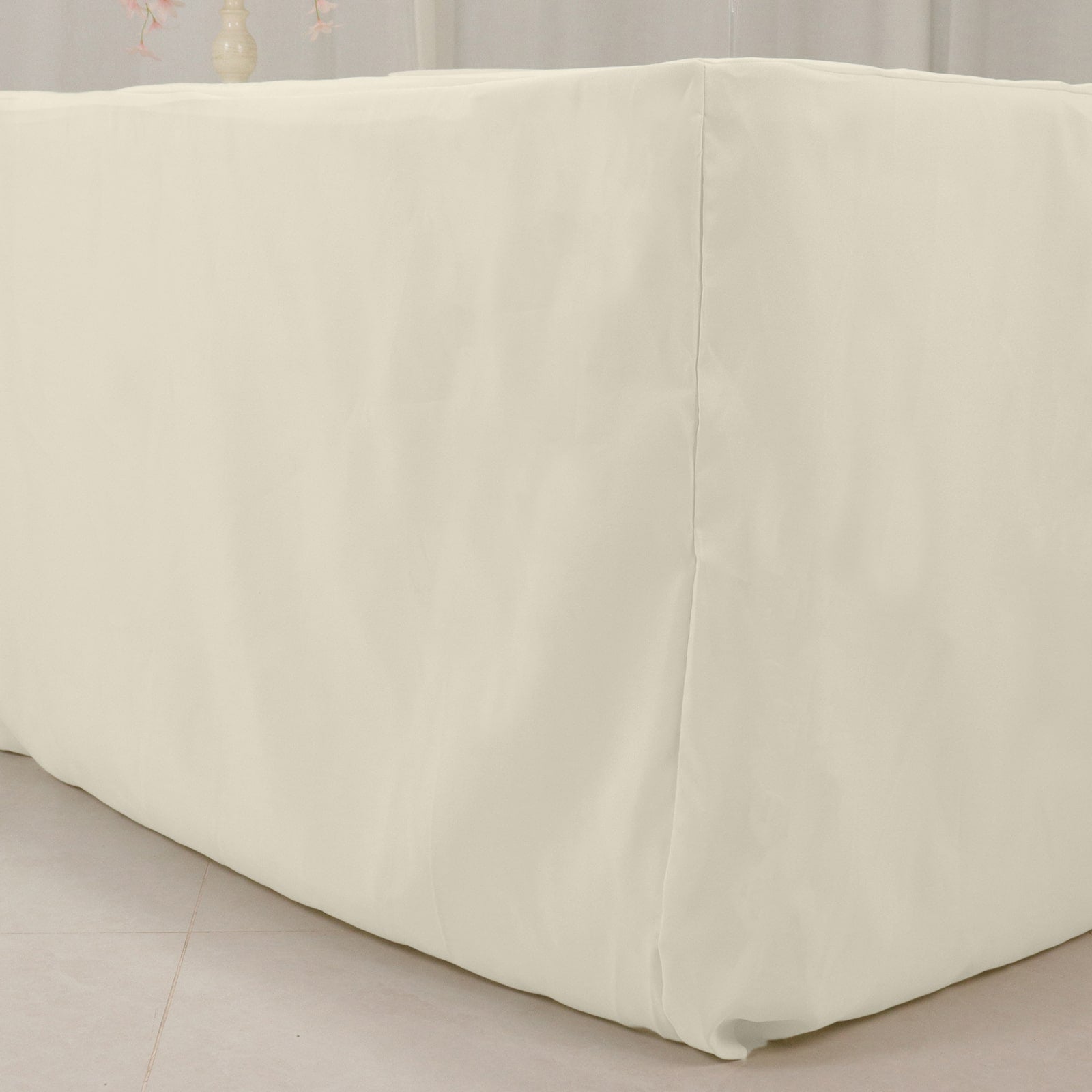 Ivory 8ft fitted polyester tablecloth for rectangle tables.