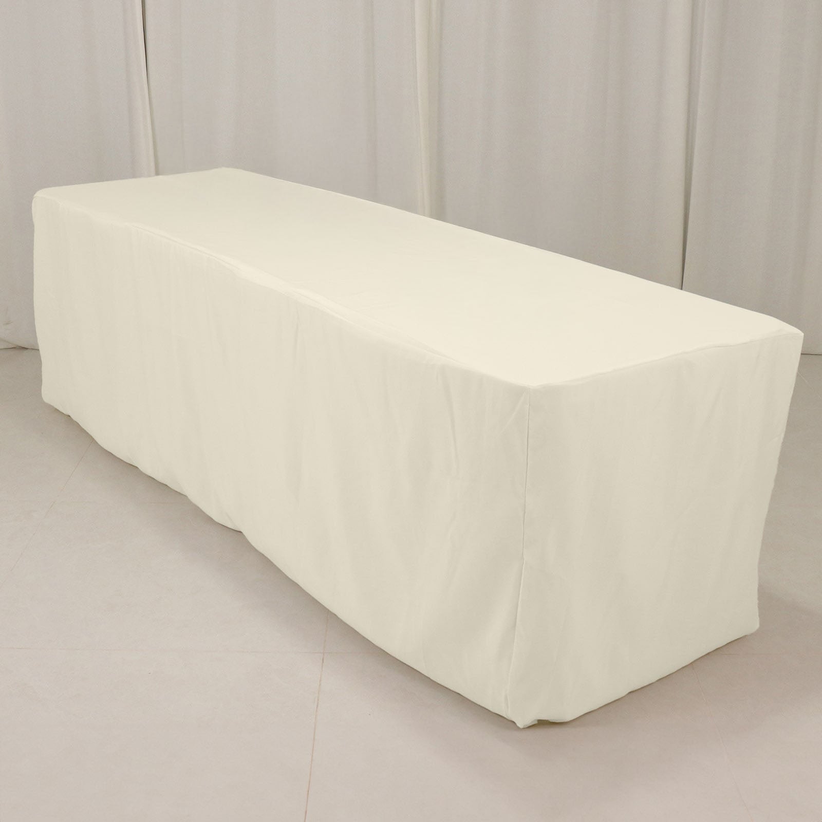Ivory fitted tablecloth for 8ft rectangle tables, 220GSM polyester.