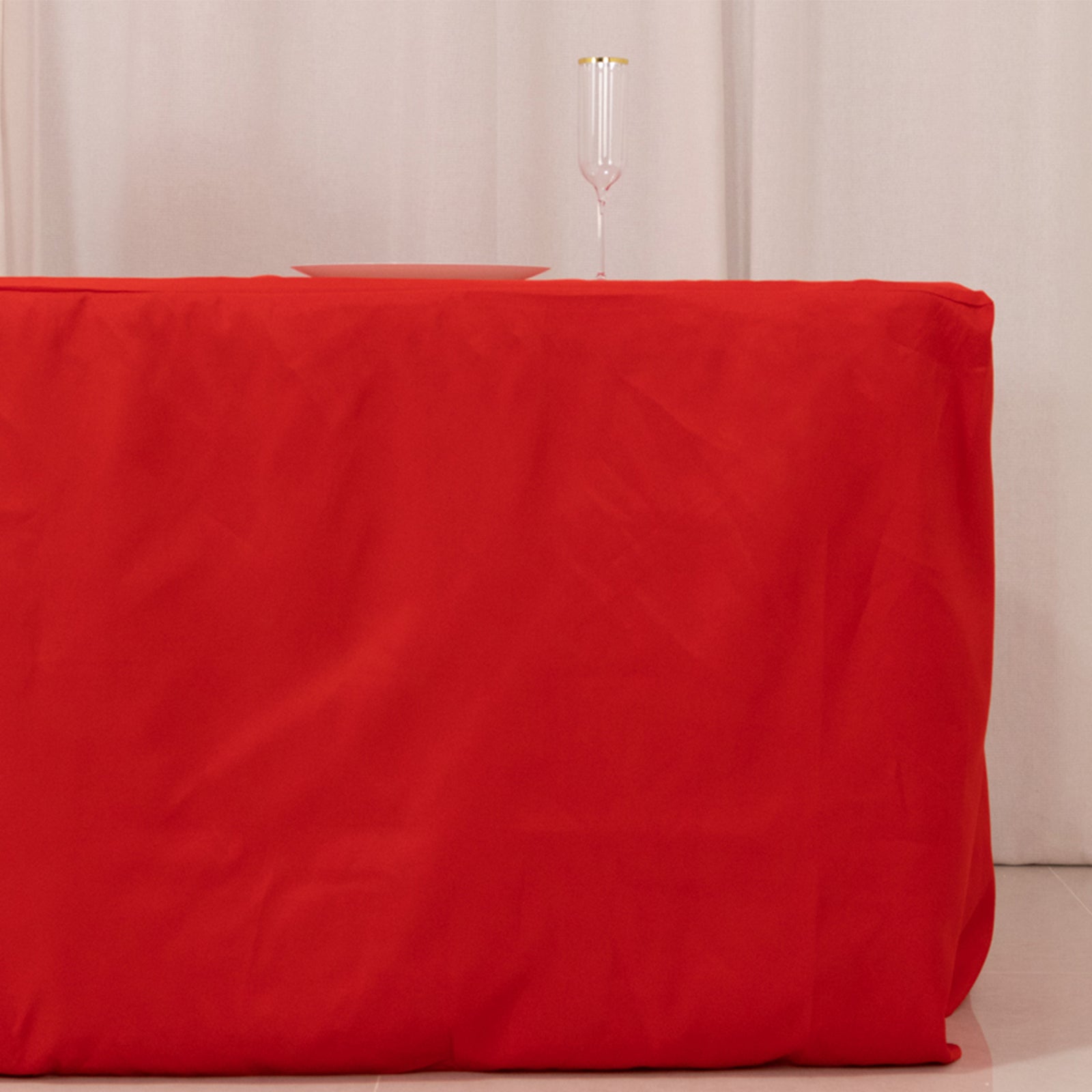 Red fitted premium polyester tablecloth for 8ft tables.