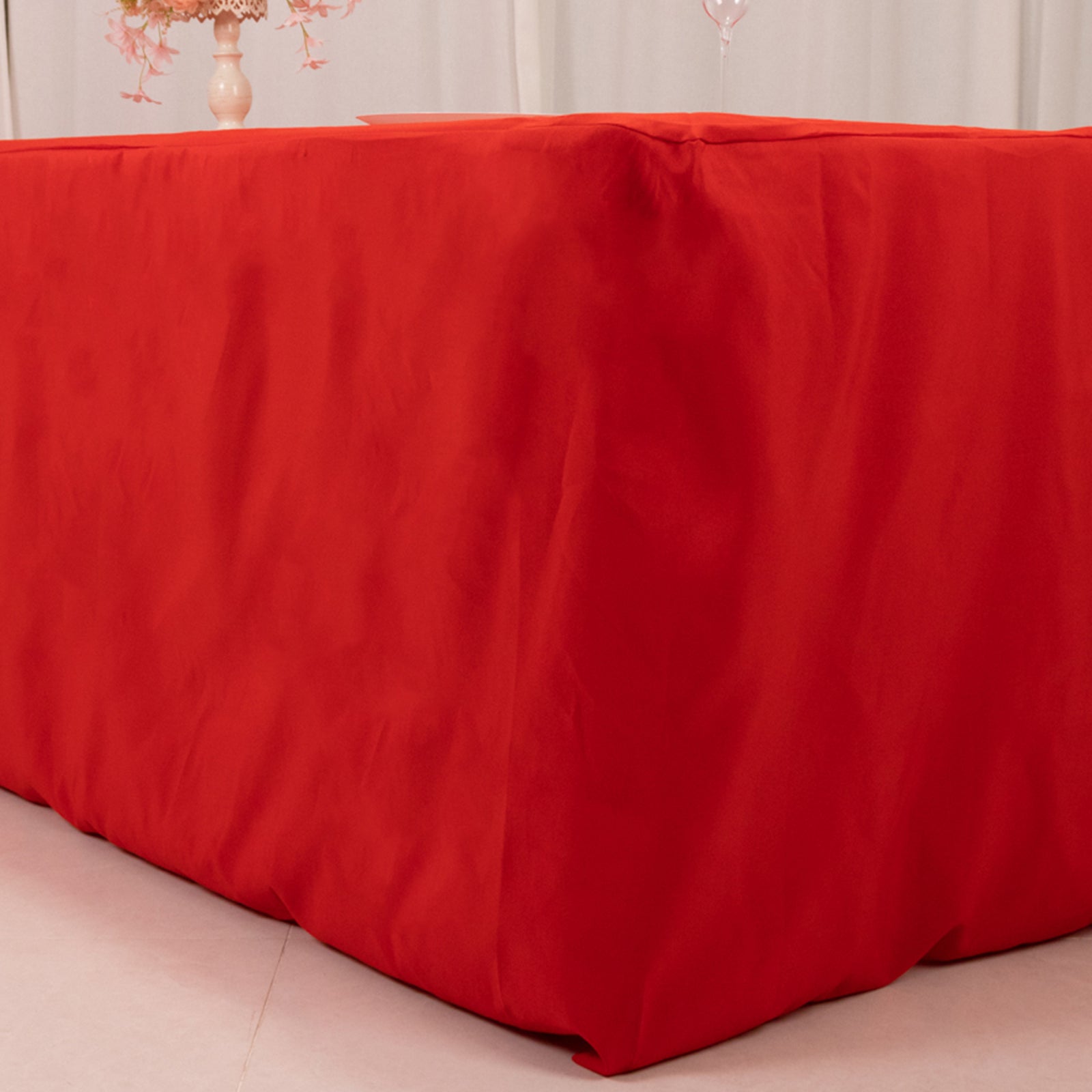 Red fitted premium polyester tablecloth for 8ft tables.