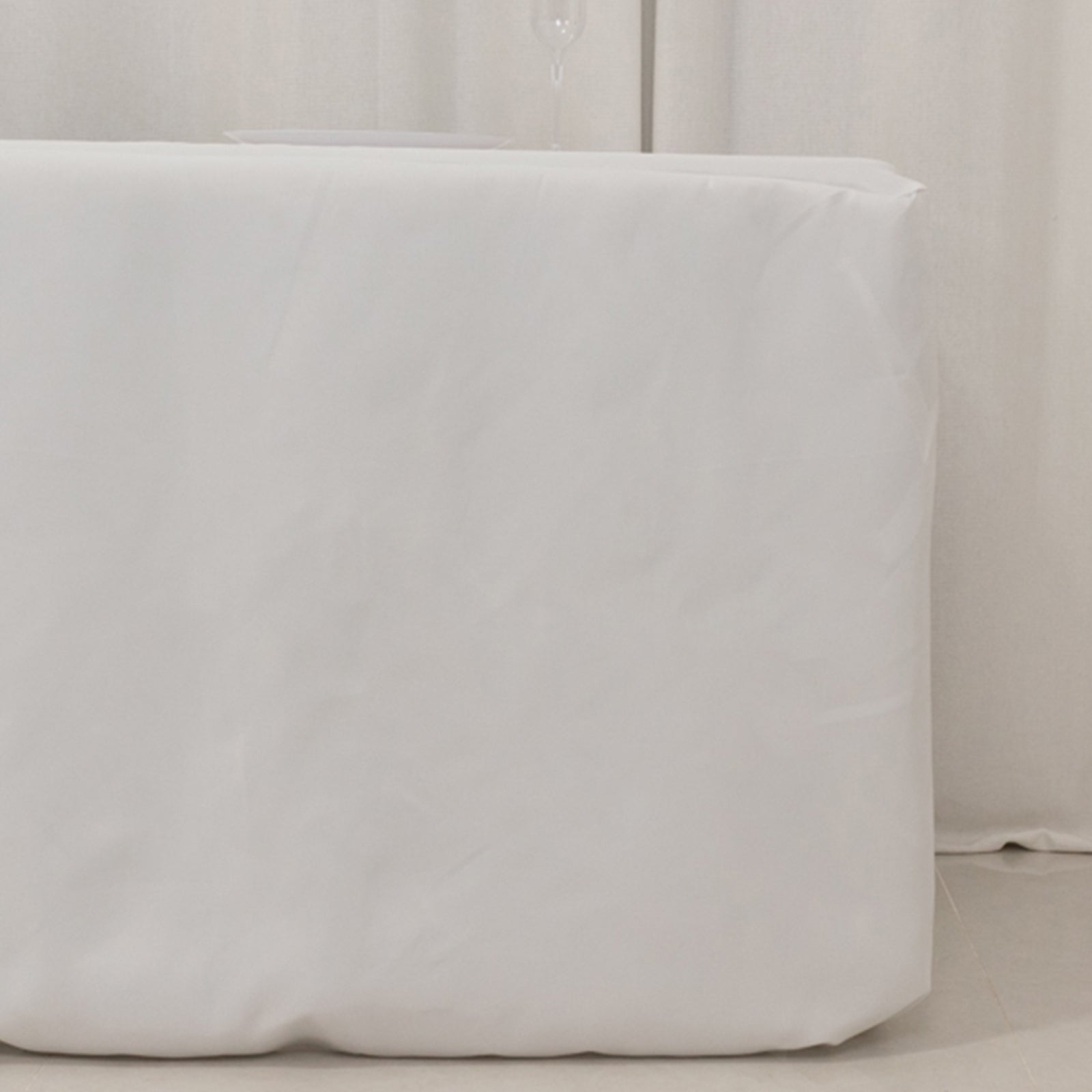 White fitted premium polyester tablecloth for 8ft tables.