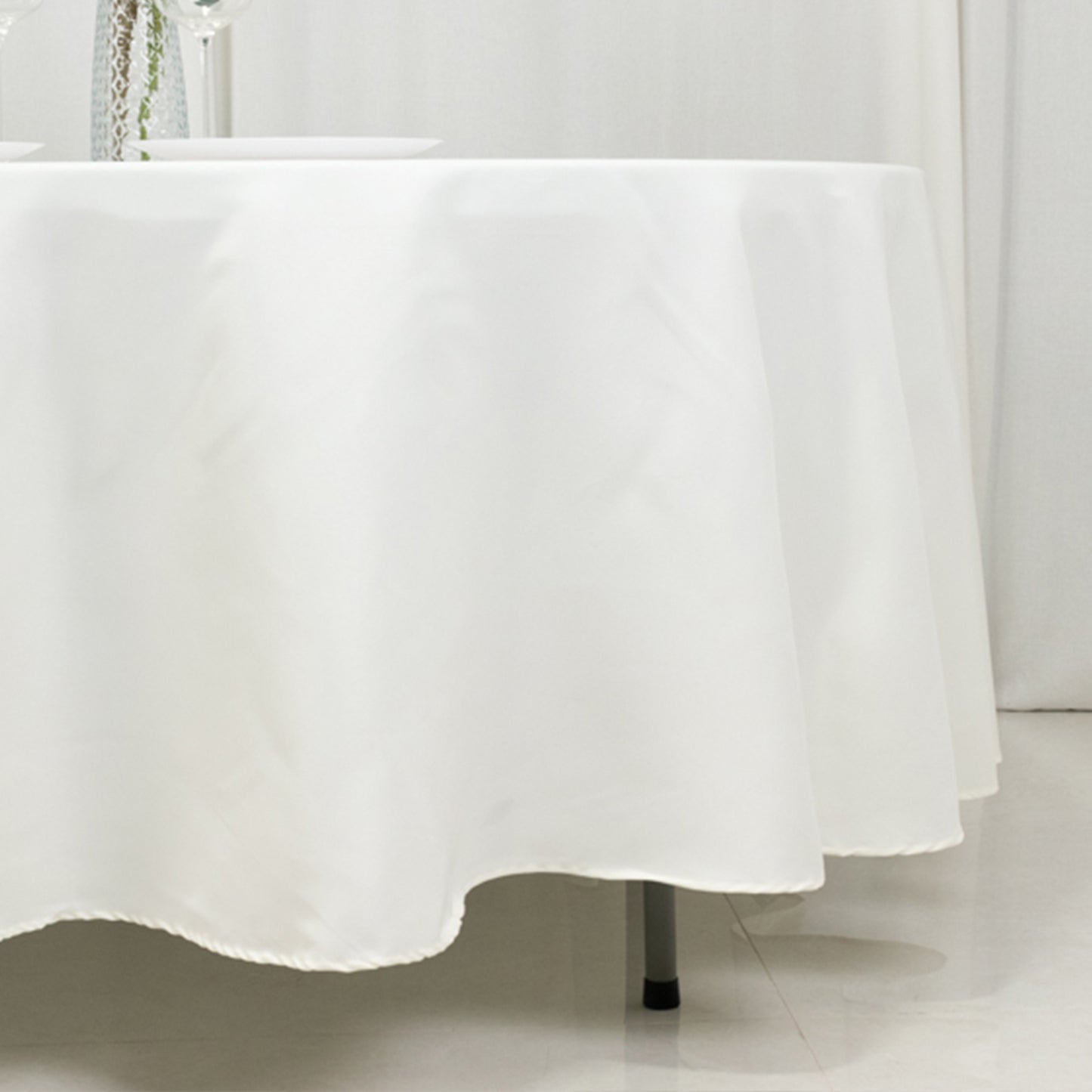 Ivory fire retardant tablecloth on a round table.