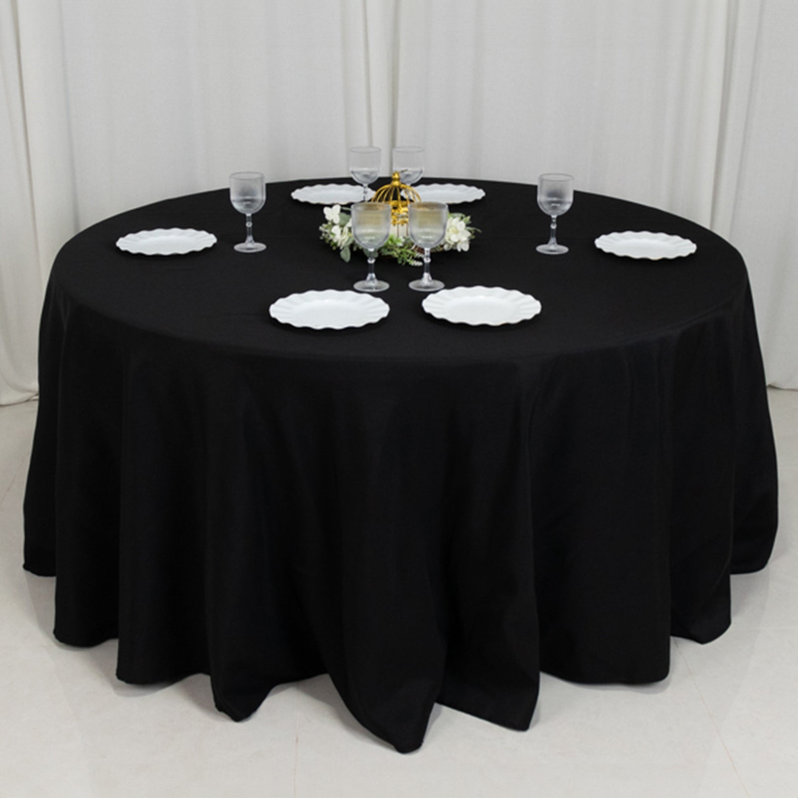 Black seamless round tablecloth for a 5-foot table with floor-length drop.