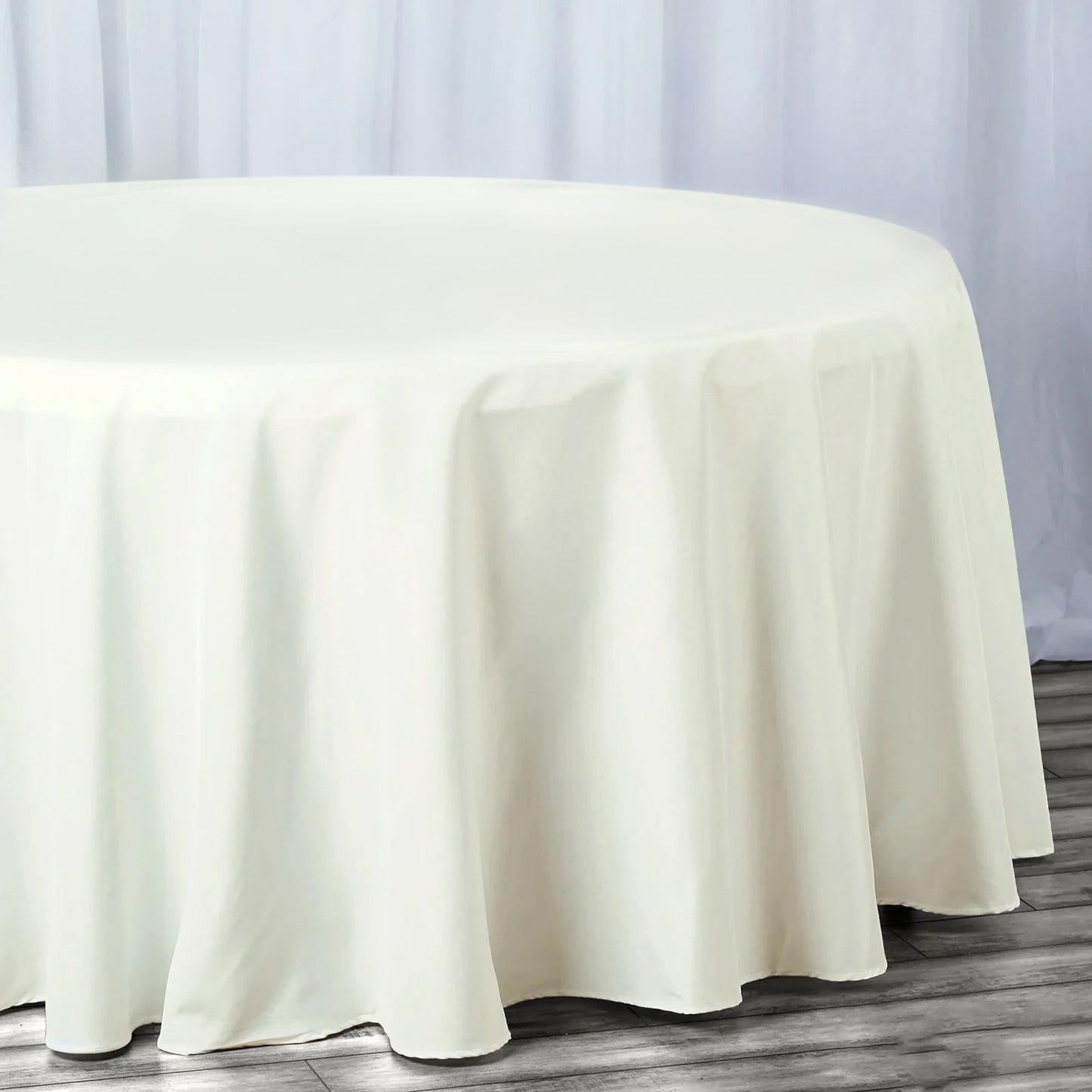 Ivory fire retardant round tablecloth for 6-foot tables, seamless design.