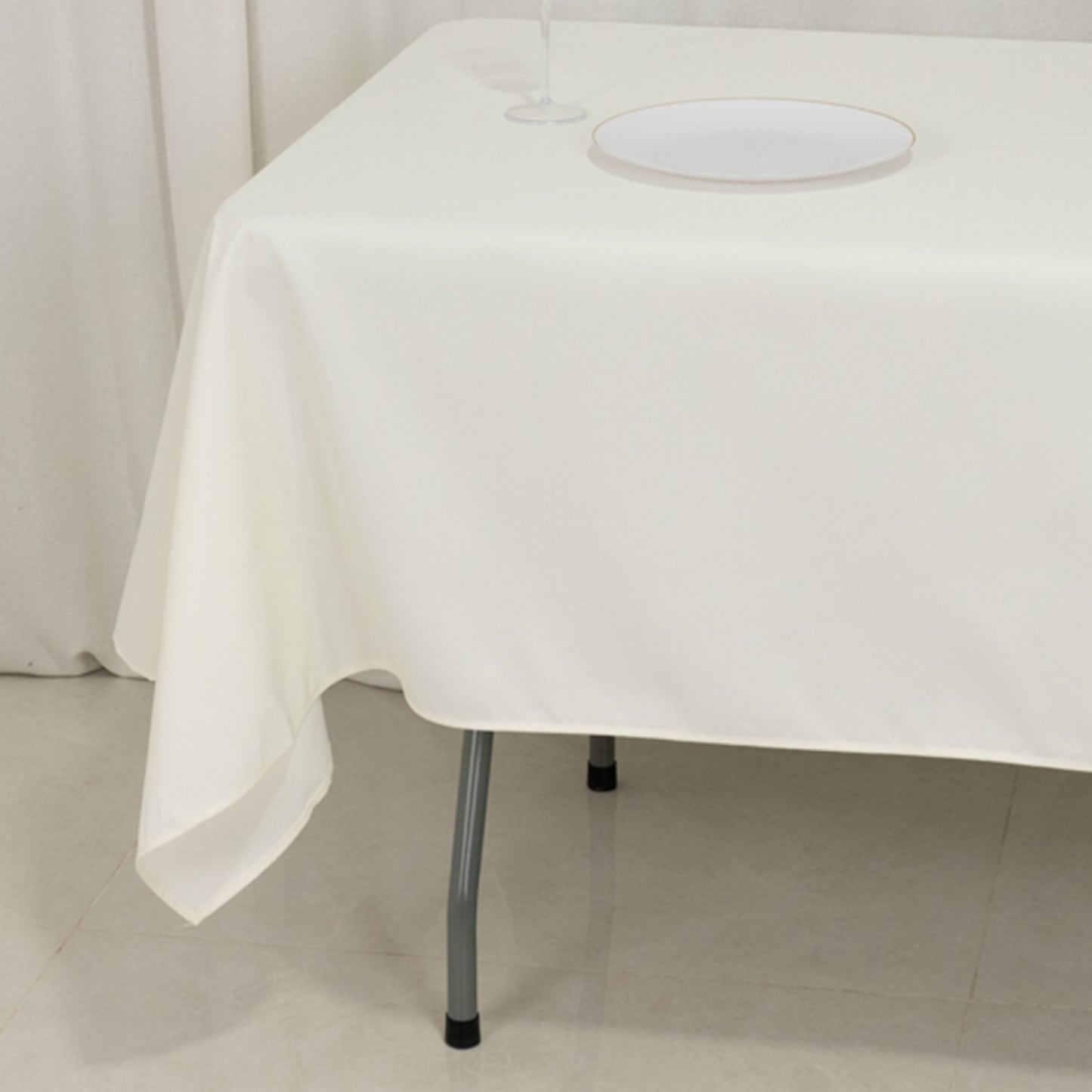 Ivory fire retardant tablecloth on a rectangular table.